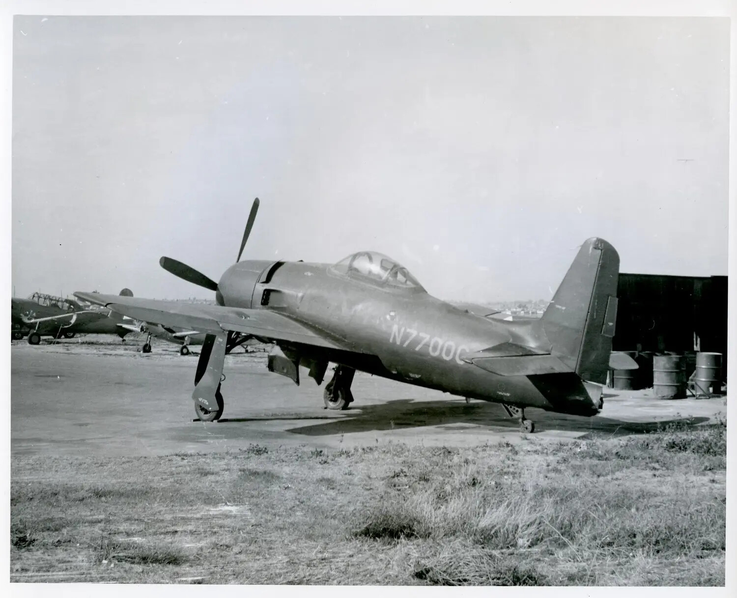 Civilian-Registered Bell P-63 Kingcobra 'N7700C' on the Ramp with T-6 Texan Trainers