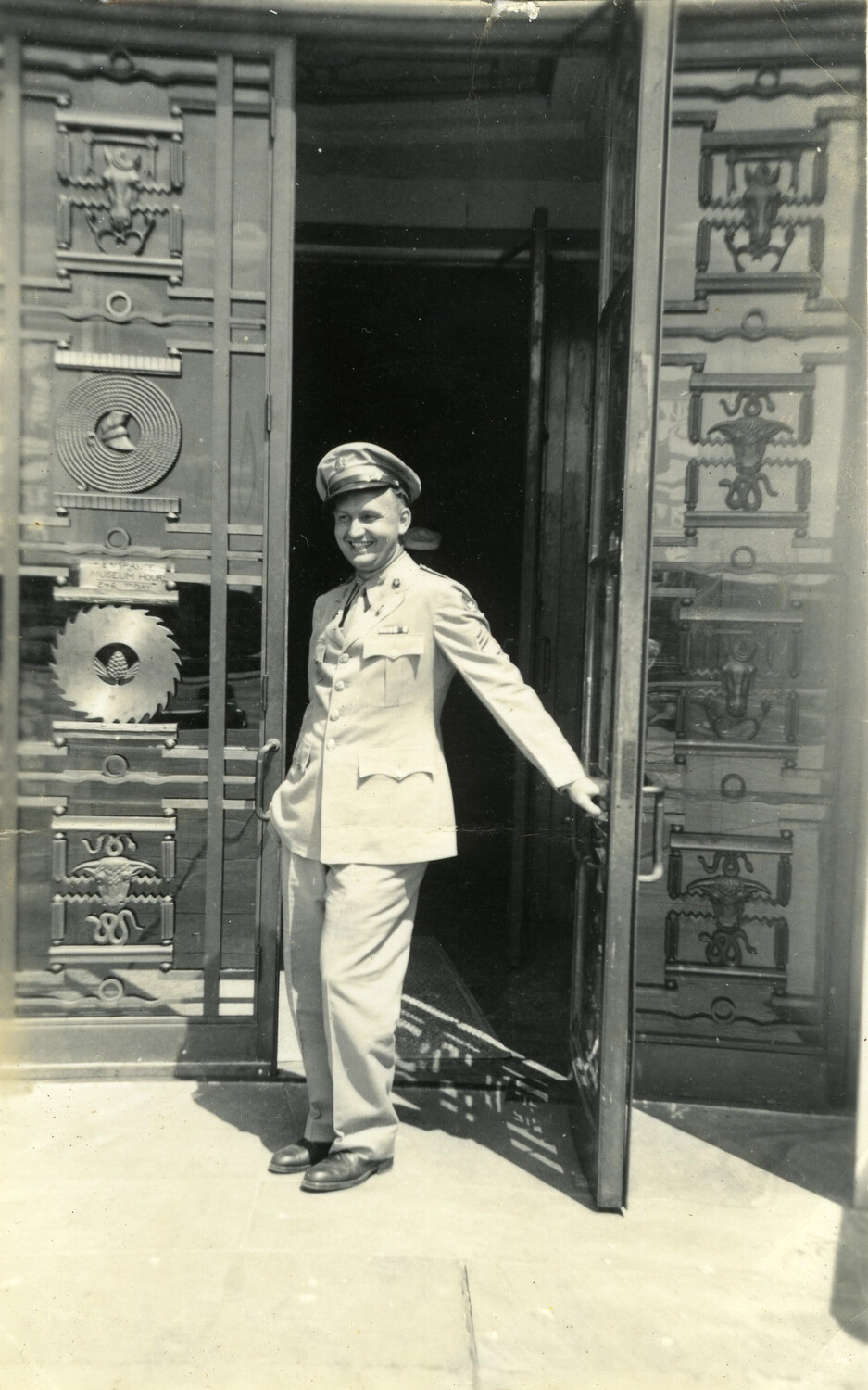 U.S. Navy Serviceman at Museum Entrance, World War II Era