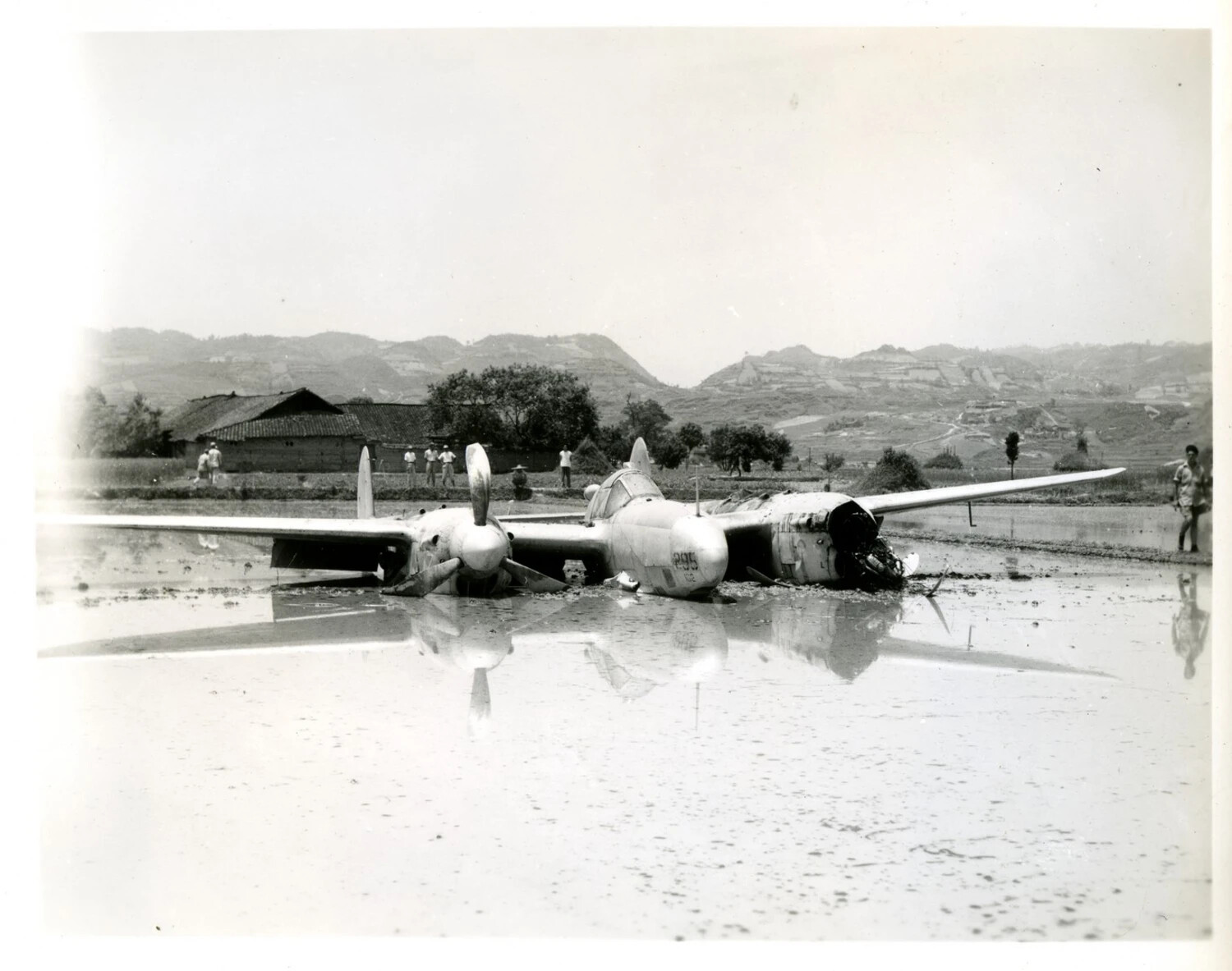 Crash-Landed Lockheed P-38 Lightning in Flooded Rice Paddy, China-Burma-India Theater, World War II
