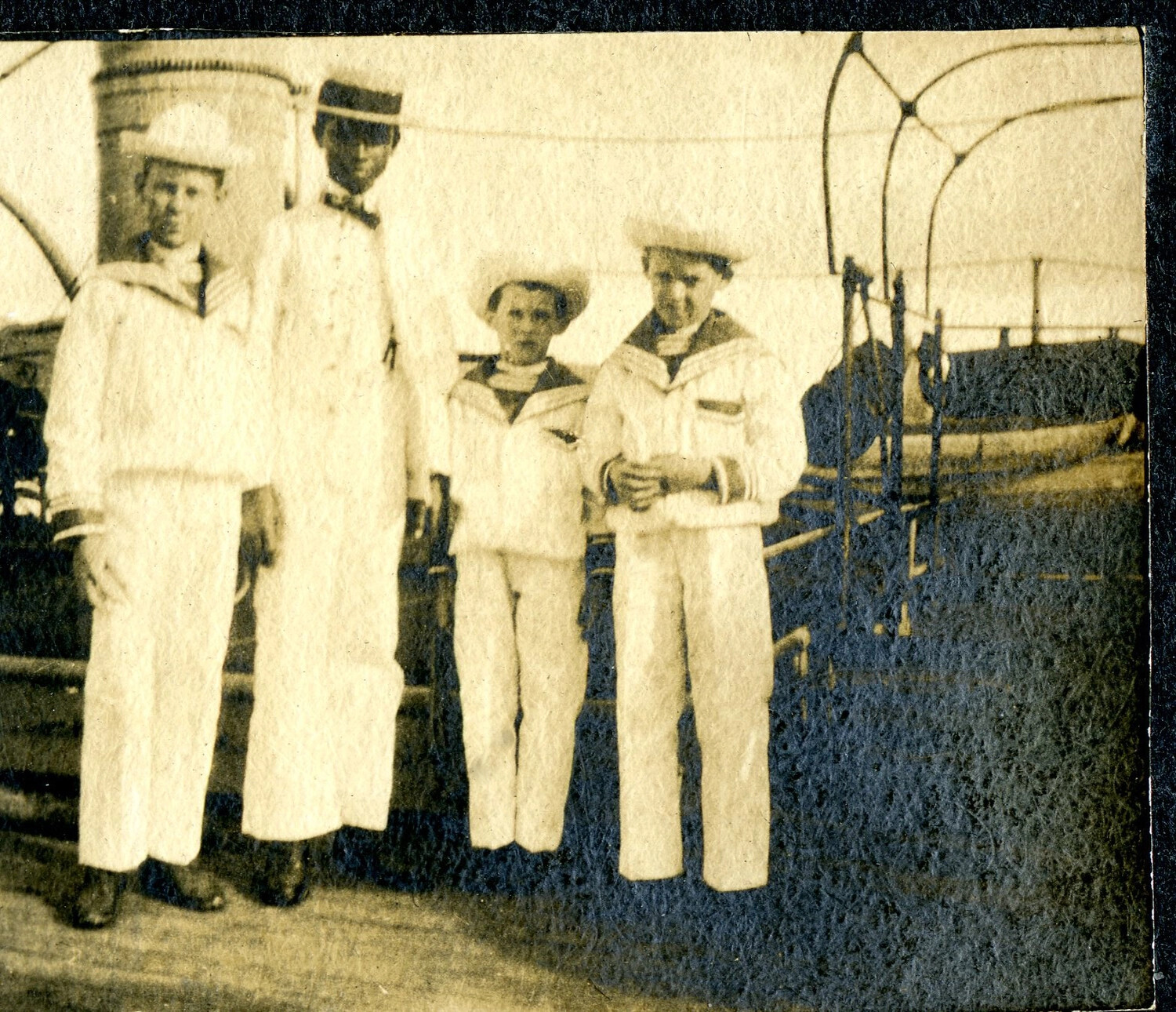 Four Figures in White Uniform on Deck, St. Thomas Port Call ("Little Danes" Detail View)