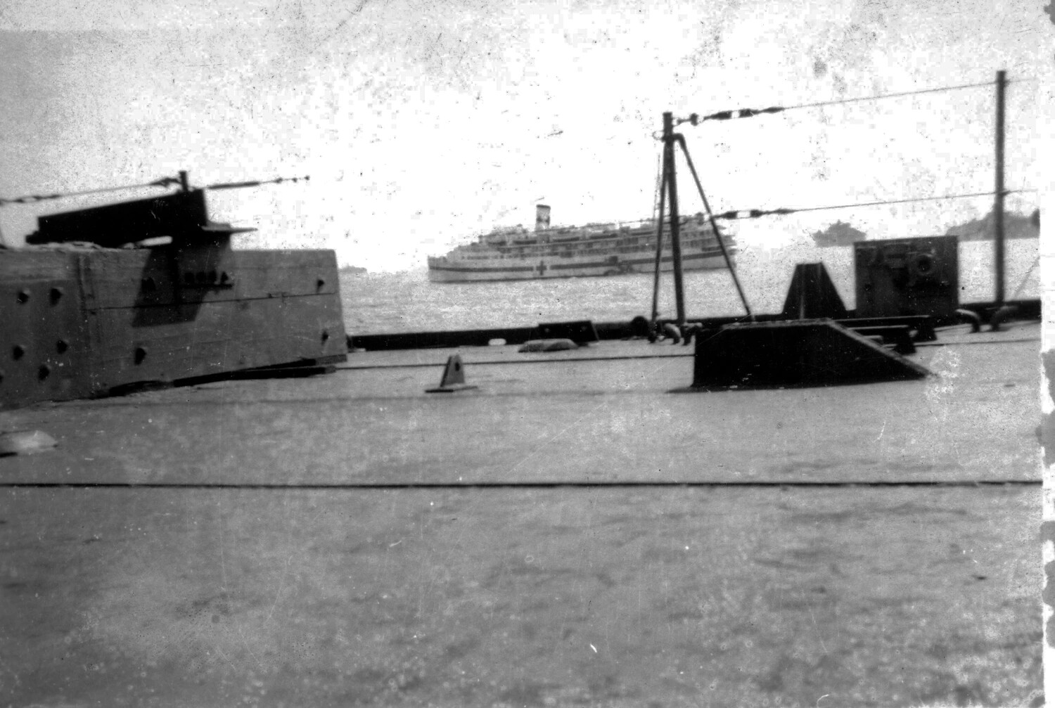 Gun Turret and Hospital Ship Offshore, Iwo Jima Invasion Anchorage, 1945