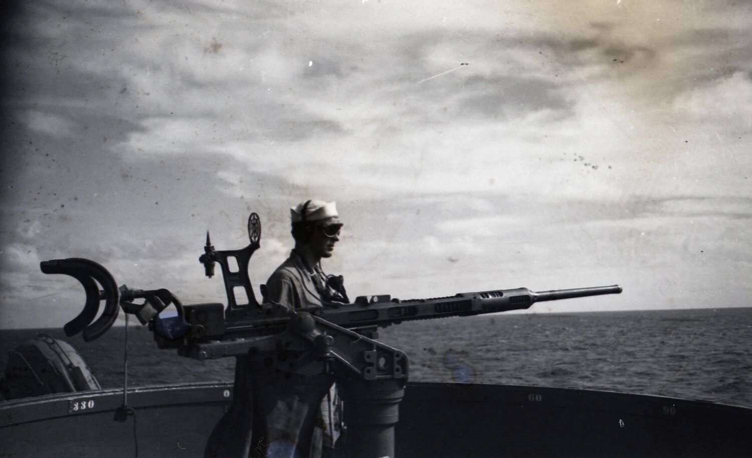 Sailor Manning .50 Caliber Anti-Aircraft Machine Gun Aboard Ship, WWII China-Burma-India Theater