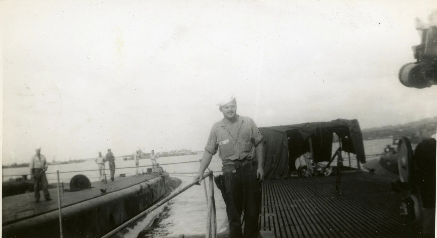 Submariner on Deck Beside Moored Submarine, WWII Era