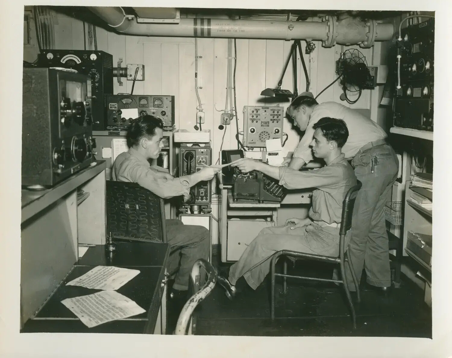 Radiomen at Work in the Radio Room, USS Petrof Bay (CVE-80), World War II