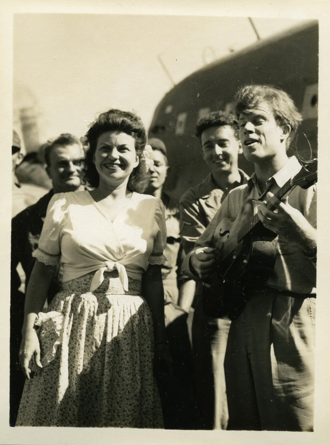 Informal Group Portrait with Guitar Player and Aircraft, CBI Theater, Myitkyina, Burma, WWII