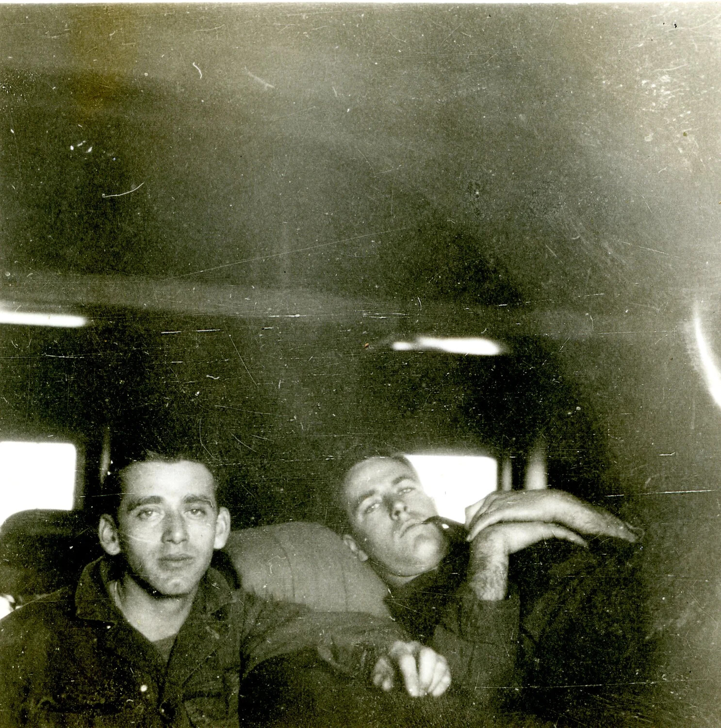 Two Airmen Resting in Vehicle Interior, 345th Bomber Group, Ie Shima