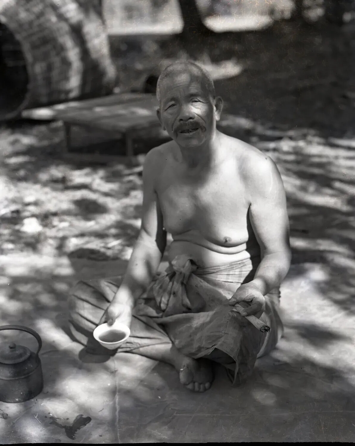 Portrait of an Elderly Local Man with Tea Bowl and Cigar, China-Burma Theater, World War II