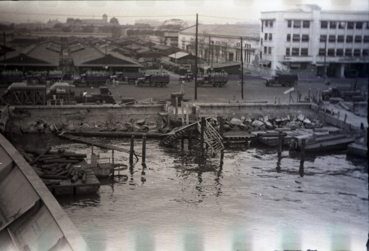 War-Damaged Manila Harbor with U.S. Army Trucks and Wrecked Pier, 1945