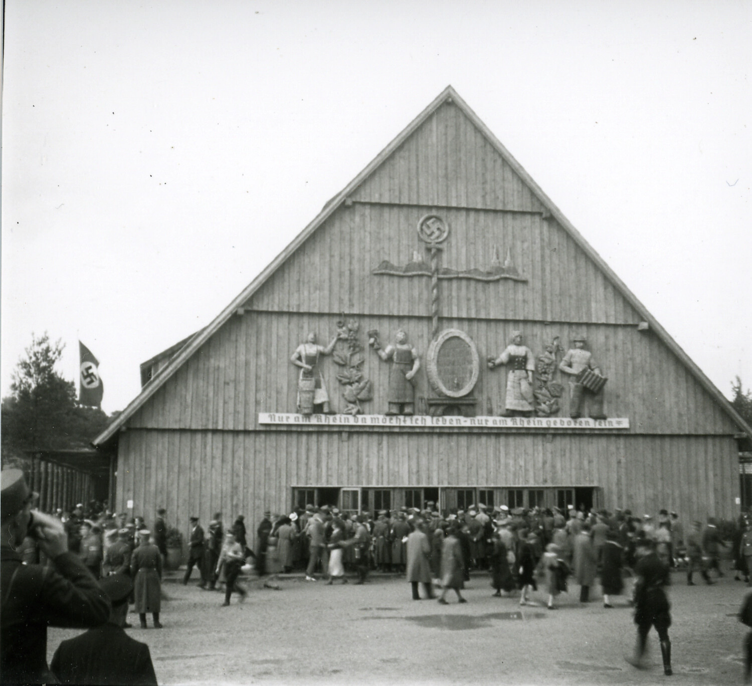 Rhineland-Themed Exhibition Hall with Nazi Regalia and Crowd, Germany, 1930s