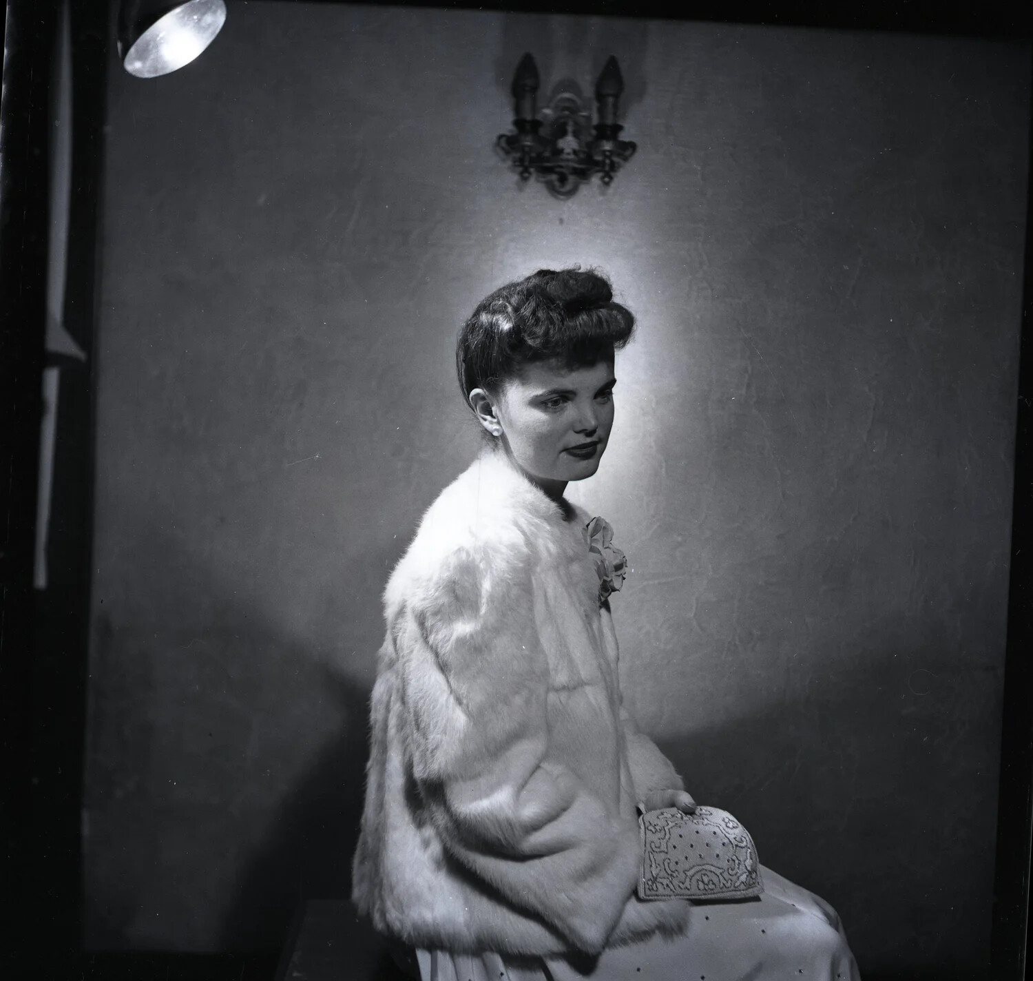 Studio Portrait of a Young Woman in Fur Jacket, Alternate Pose with Visible Studio Light