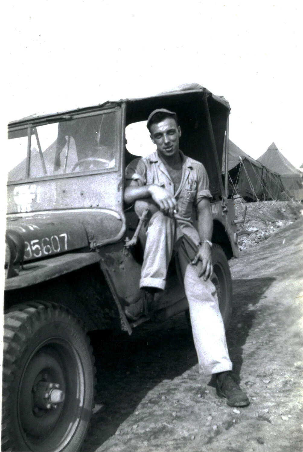 U.S. Marine Seated on Jeep Fender at Camp, WWII (5th Marine Division)