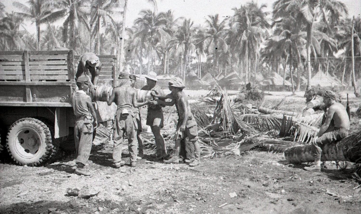 Work Party Loading Truck in Palm Grove, Luzon, Philippines, WWII