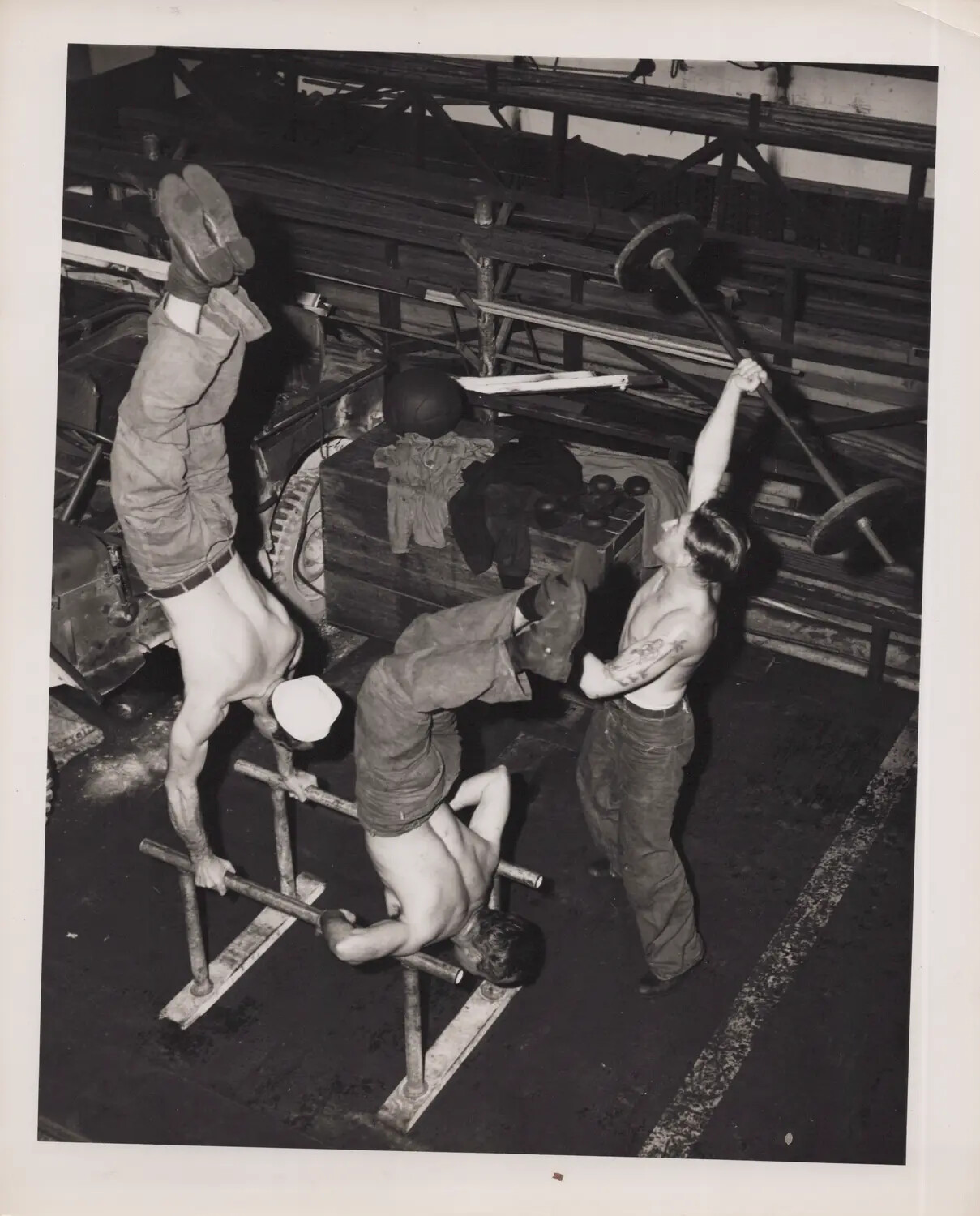 Sailors Exercising with Improvised Gymnastic and Weightlifting Equipment on Hangar Deck, U.S. Navy Carrier, World War II