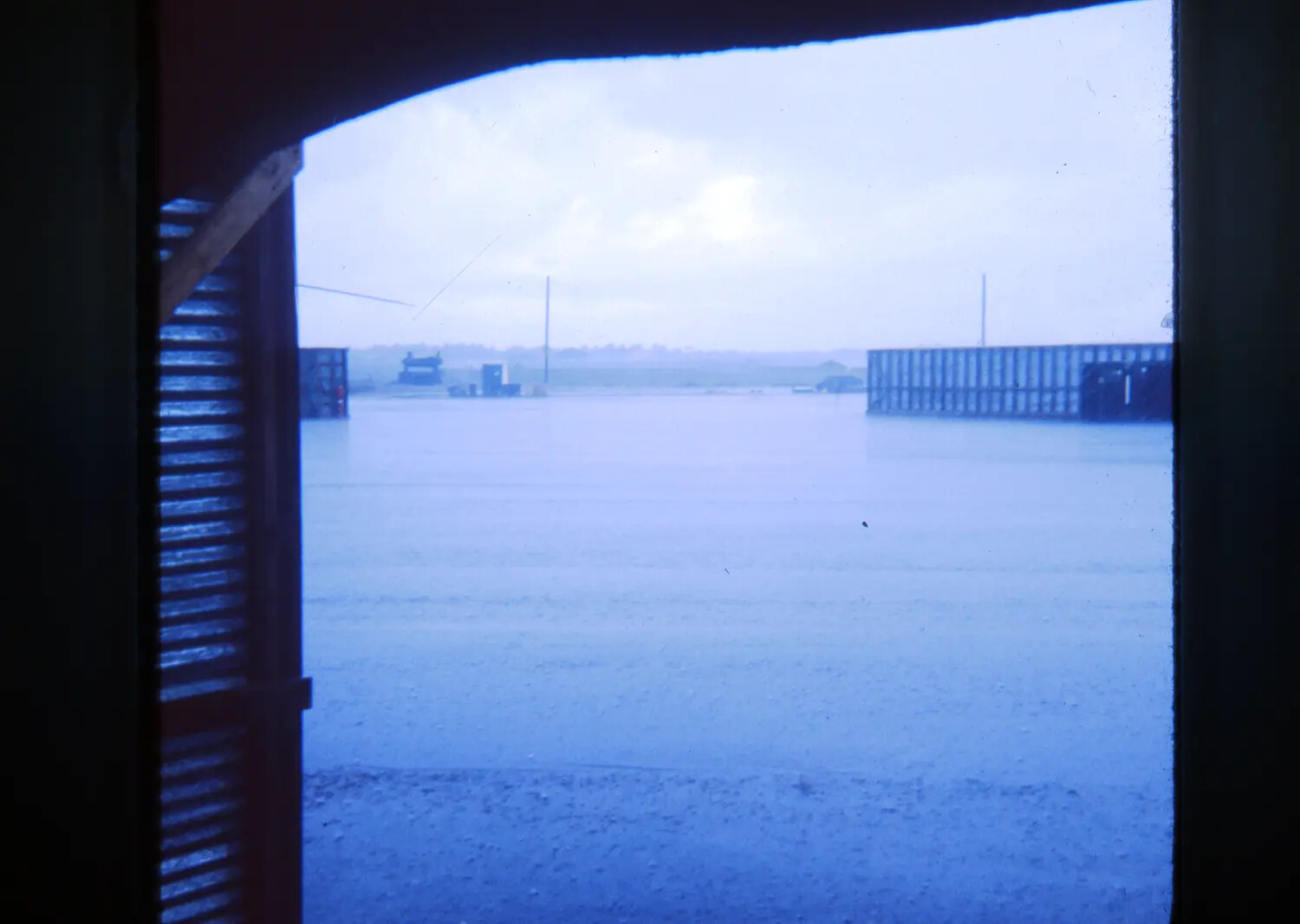 Monsoon Flooding at a U.S. Base in Vietnam, Viewed Through a Hooch Window, Vietnam War Era