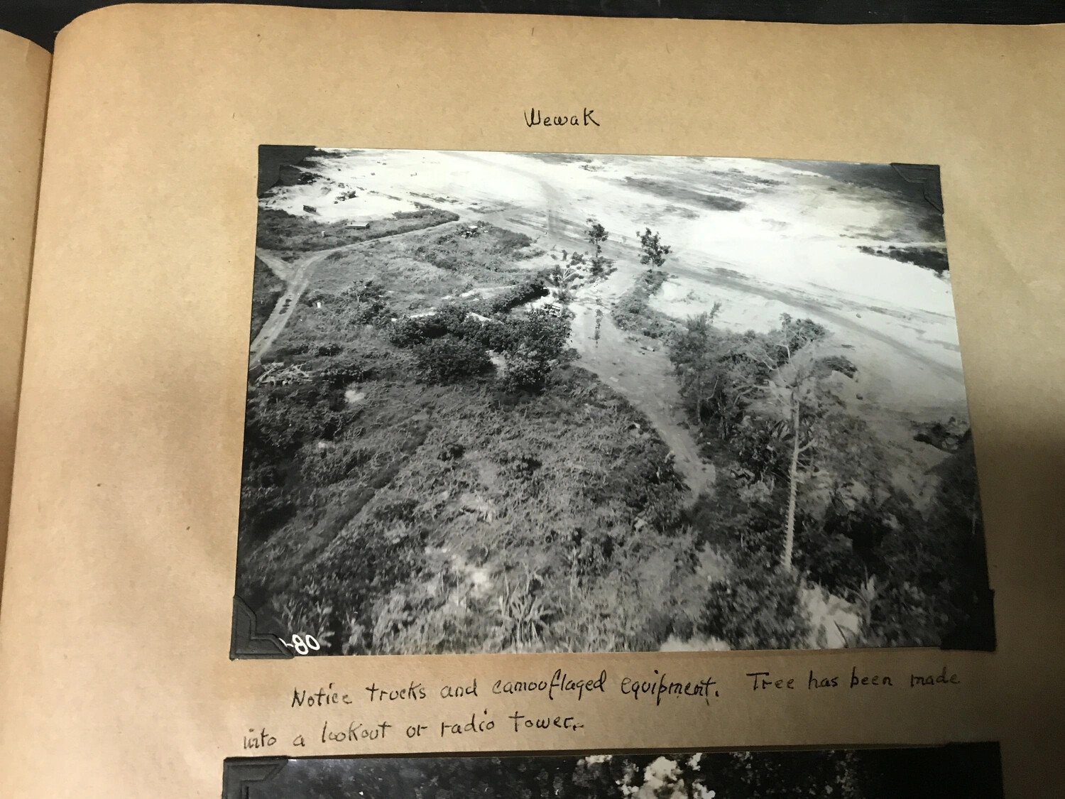 Album Page: 'Wewak' - Reconnaissance Photo with Handwritten Notes on Camouflaged Equipment