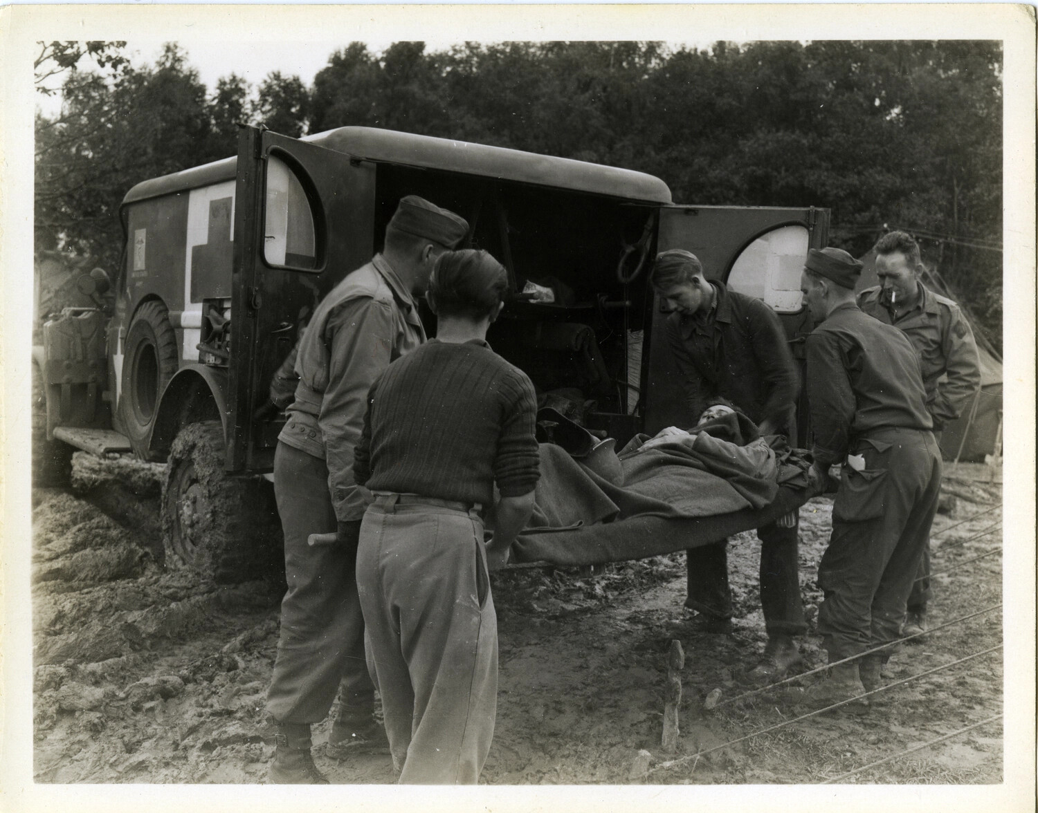 Litter Bearers Loading a Wounded Soldier into a Field Ambulance, 7th Field Hospital