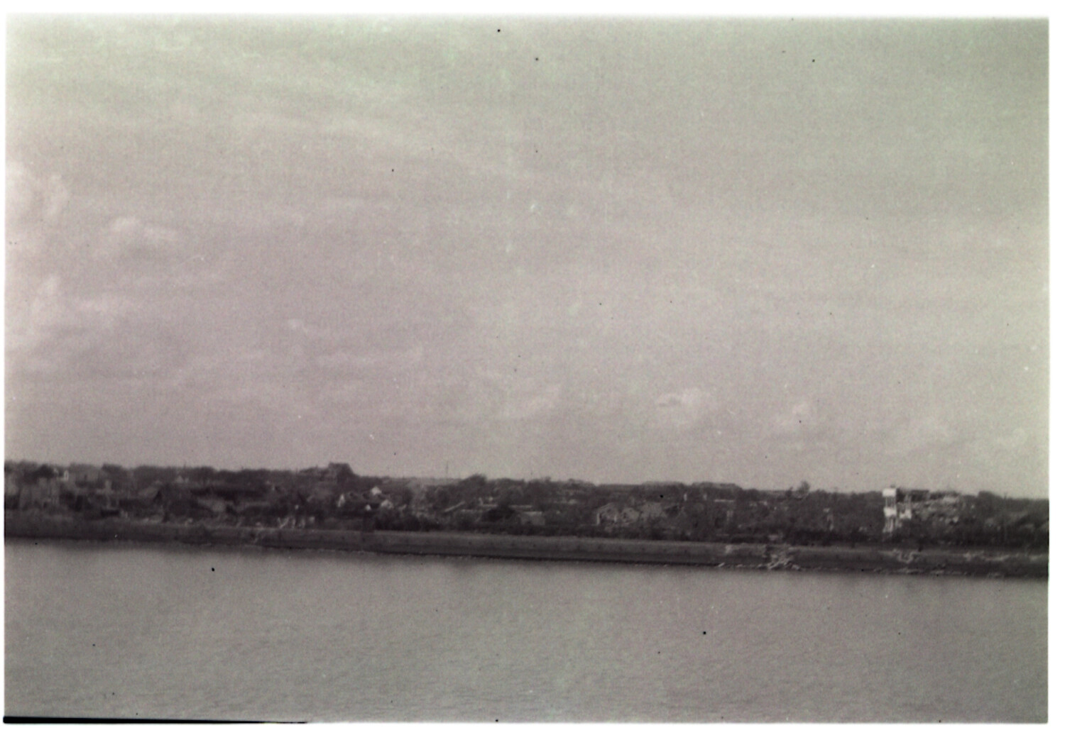 Distant Waterfront Town Viewed from Shipboard