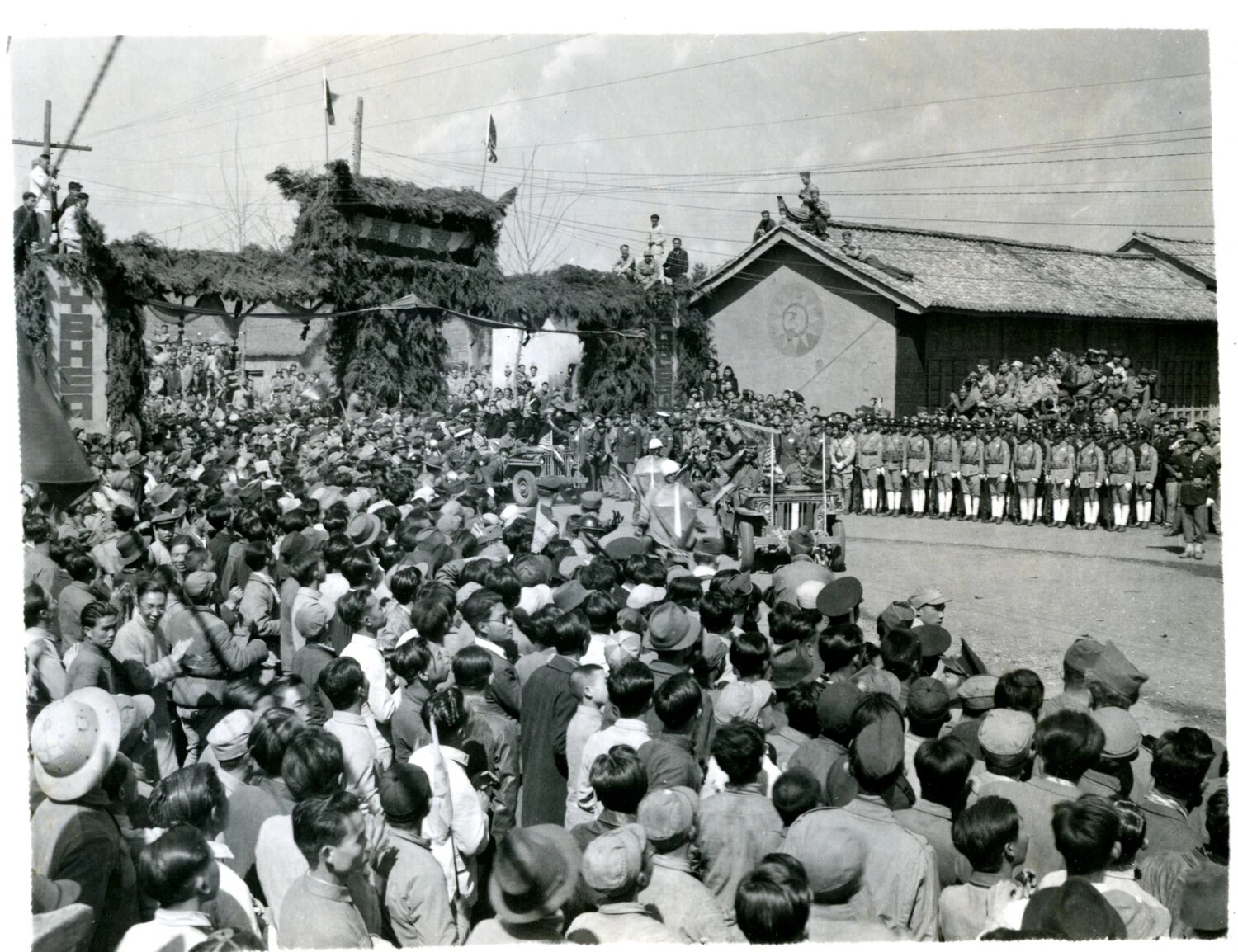 Crowd and Military Procession at Ceremonial Archway, China-Burma-India Theater, World War II