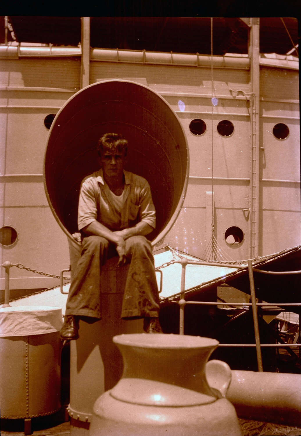 Sailor Seated in Ship's Ventilator Cowl, U.S. Navy Asiatic Fleet, China Station, 1930s