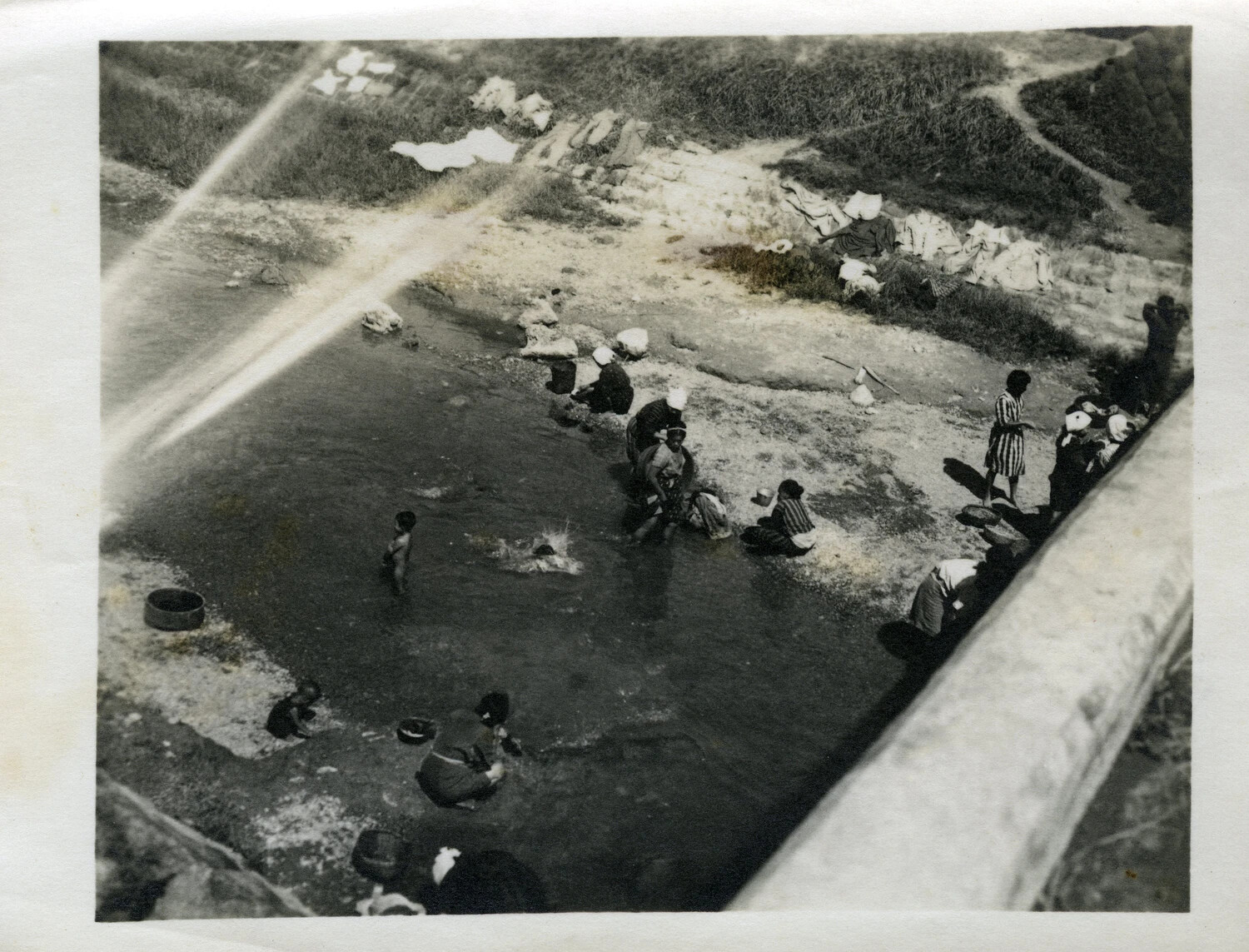 Okinawan Civilians Washing Clothes at a River Bank, Okinawa, WWII Era