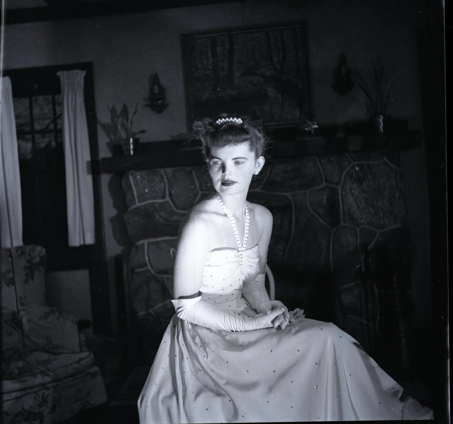 Formal Portrait of a Young Woman in Evening Gown, Fireside Setting (Mixed Roll, Military Band Negative Collection)