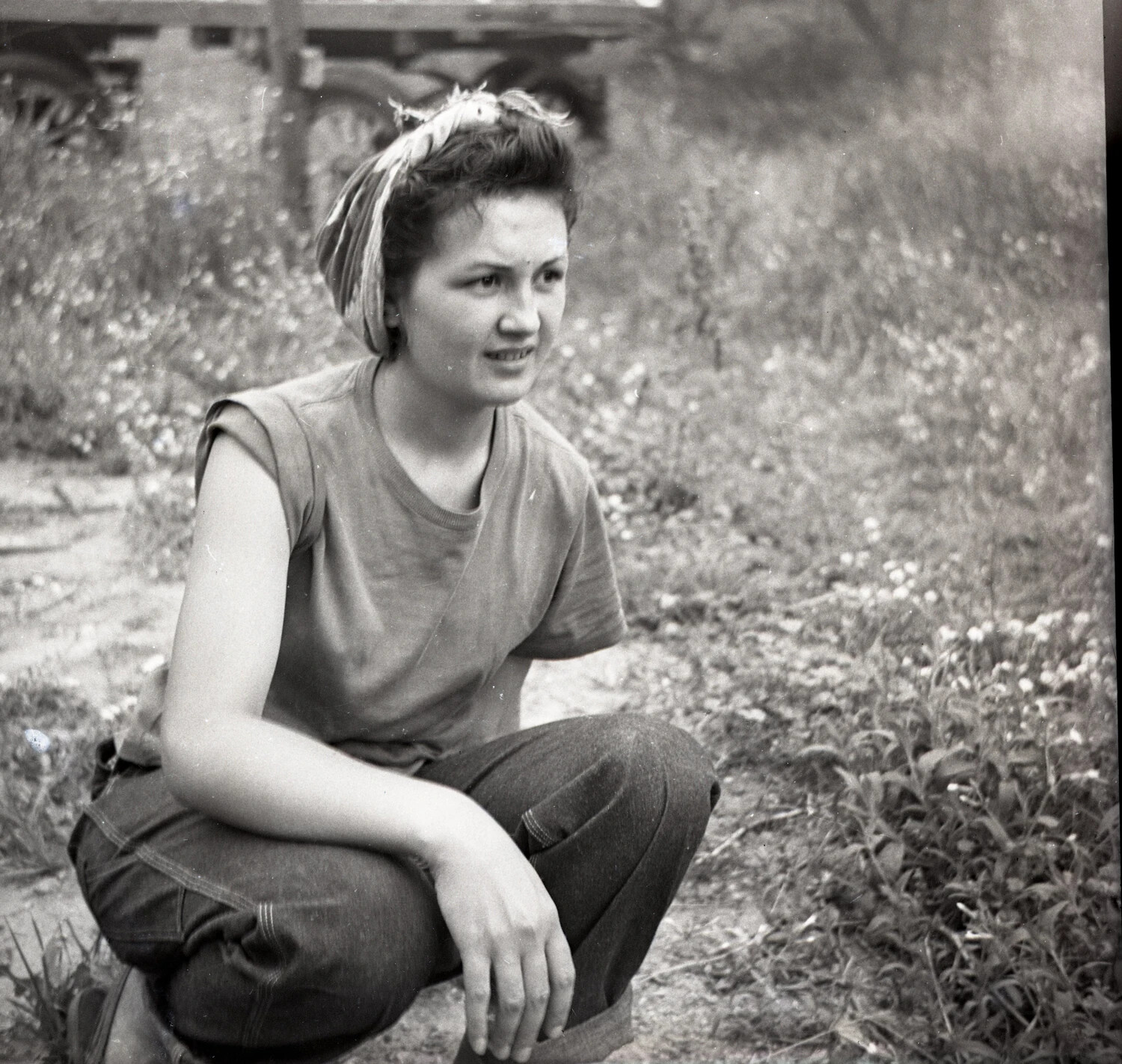 Young Woman Crouching Outdoors in Kerchief and Denim, Wartime Home Front