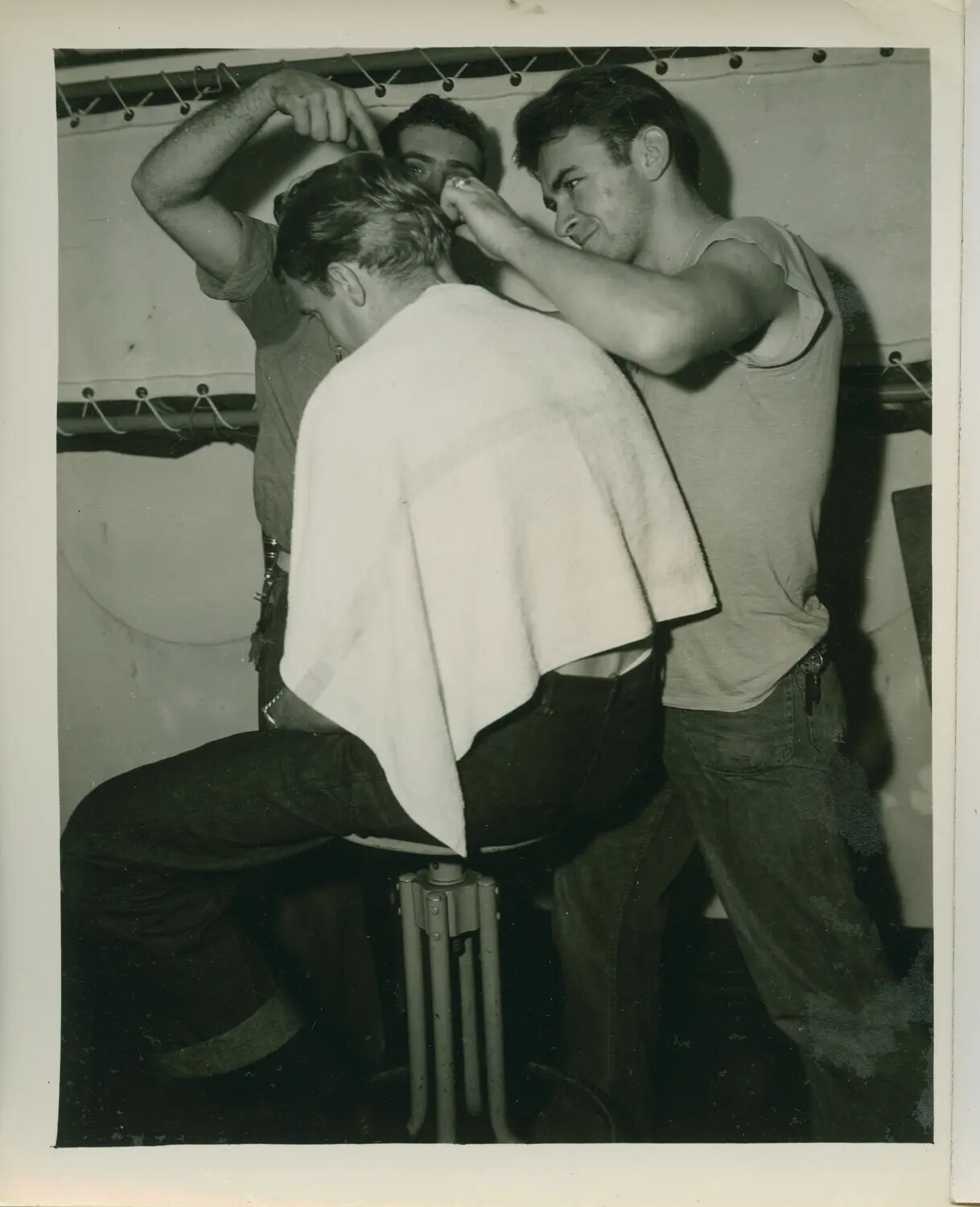 Sailors Giving a Shipboard Haircut Aboard USS Petrof Bay (CVE-80), WWII