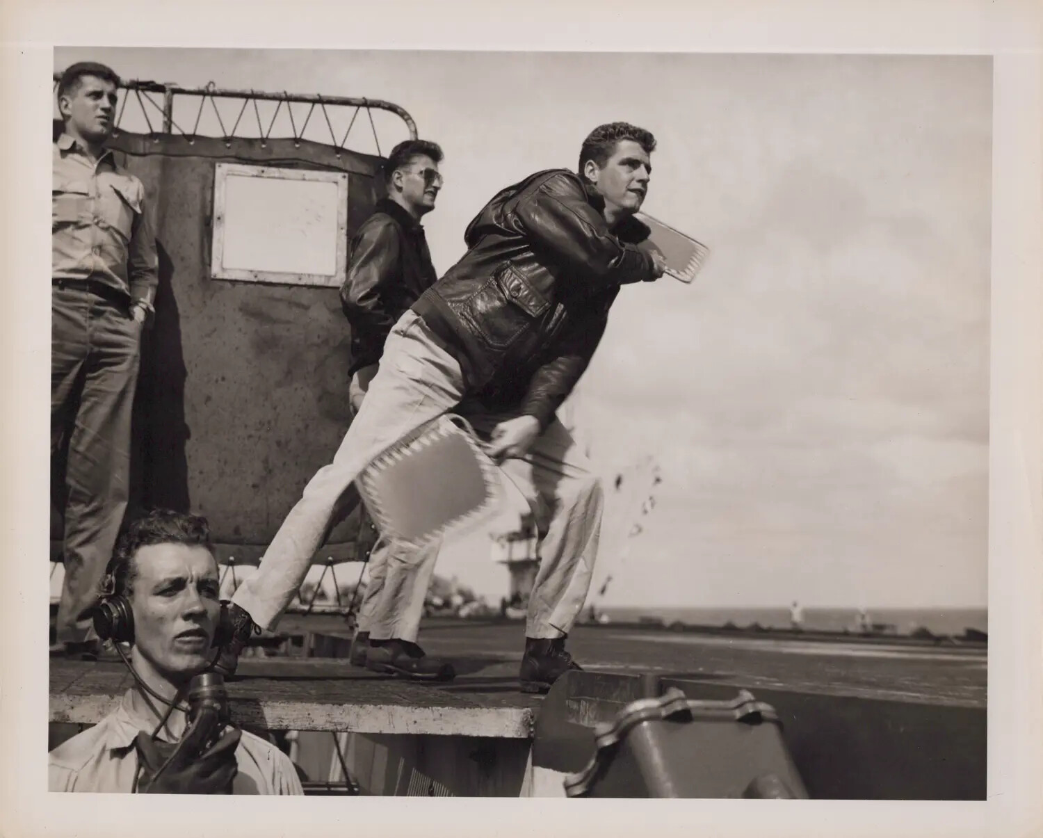 Landing Signal Officer Directing Aircraft Aboard Escort Carrier