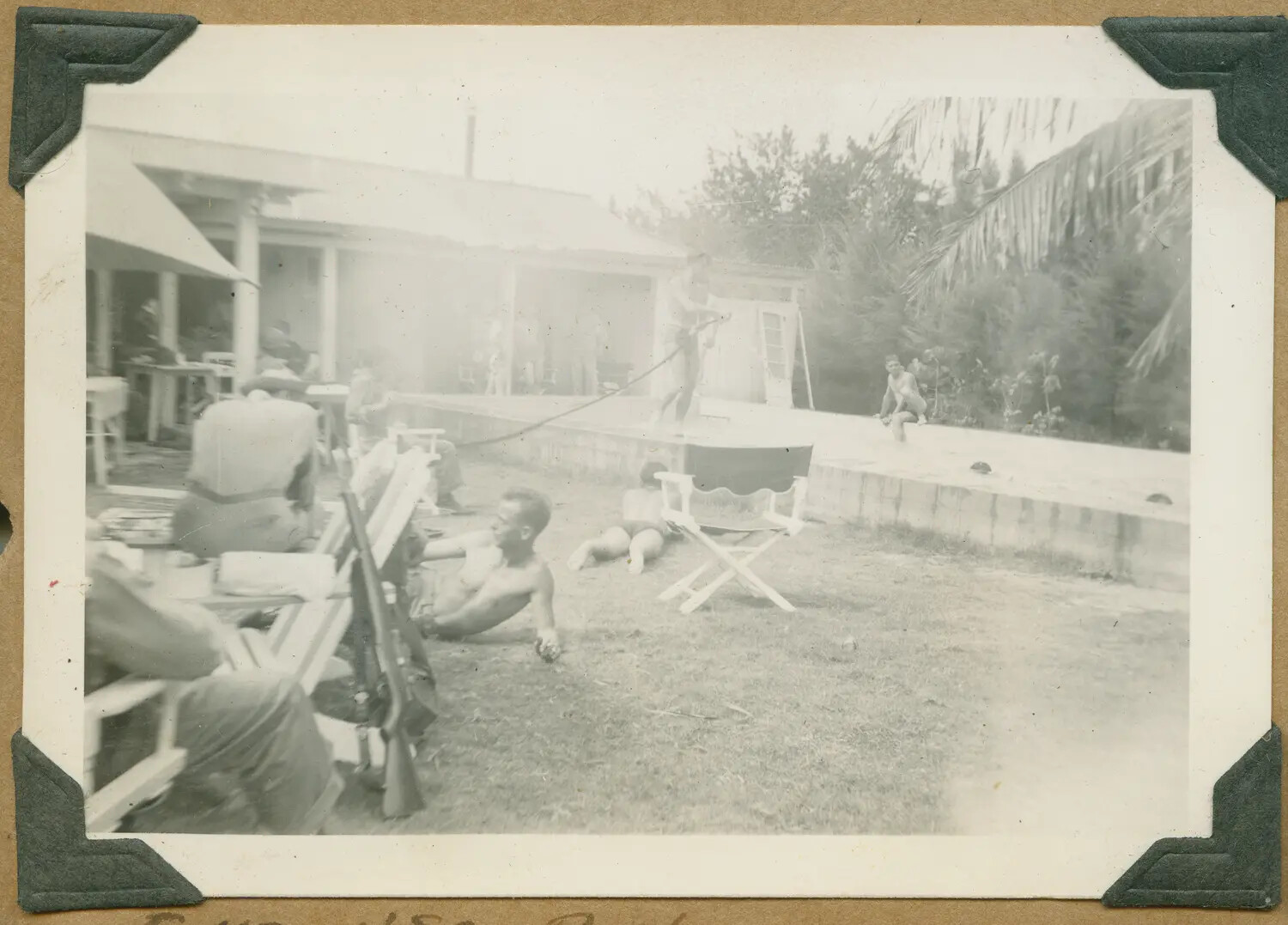 Servicemen and Rifles at Poolside Recreation Bungalow, Hawaii, World War II