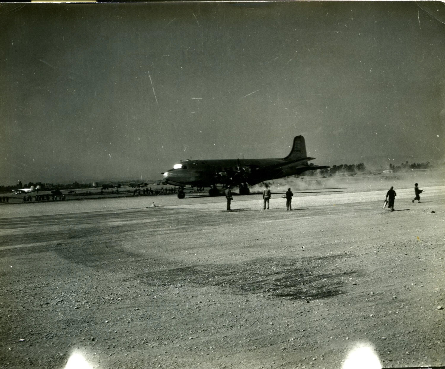 Four-Engine Transport Aircraft Taxiing on Dusty Airfield, CBI Theater, WWII