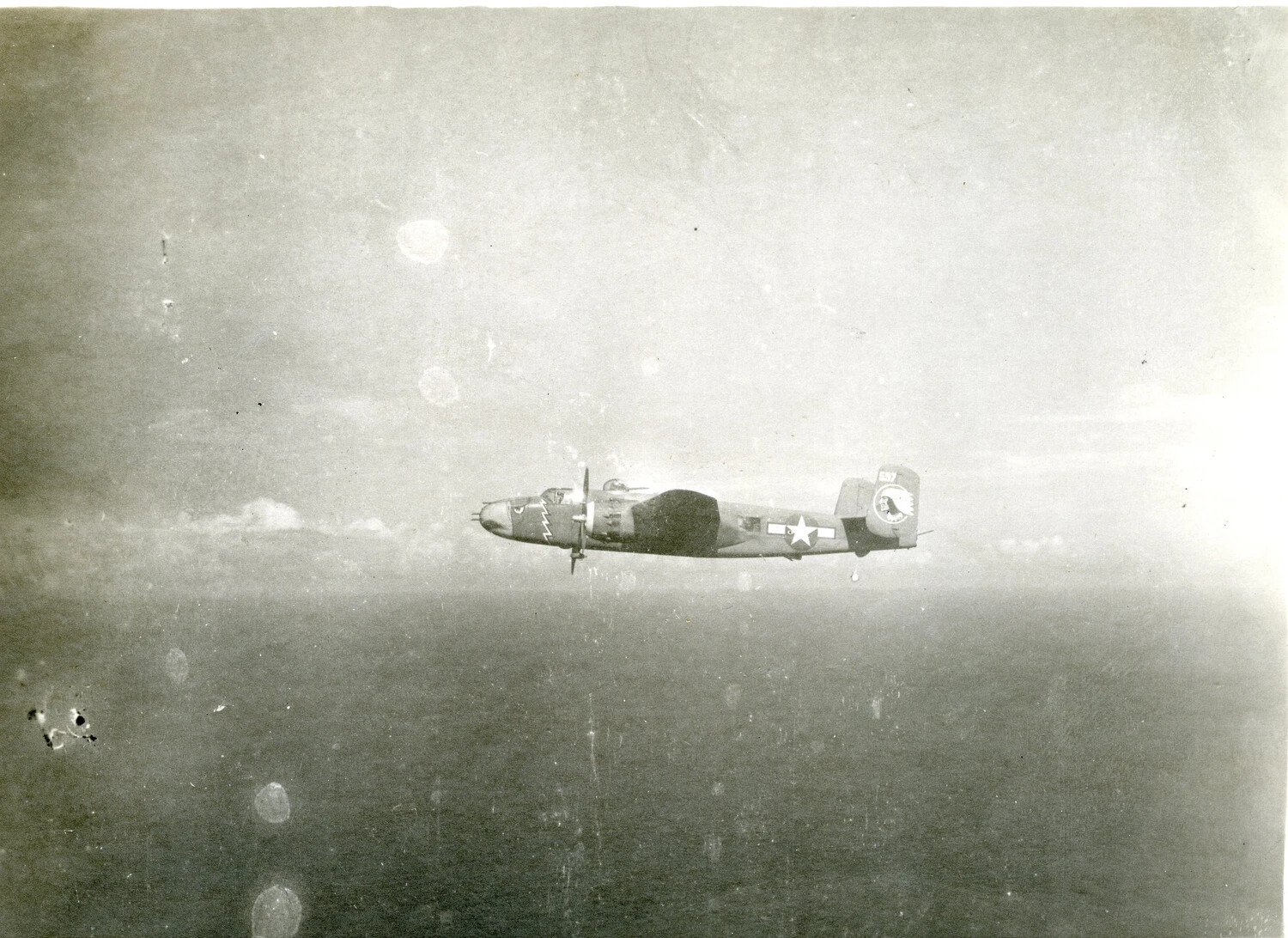 498th Bombardment Squadron B-25 Mitchell in Flight Over Open Water, Pacific Theater, 1945