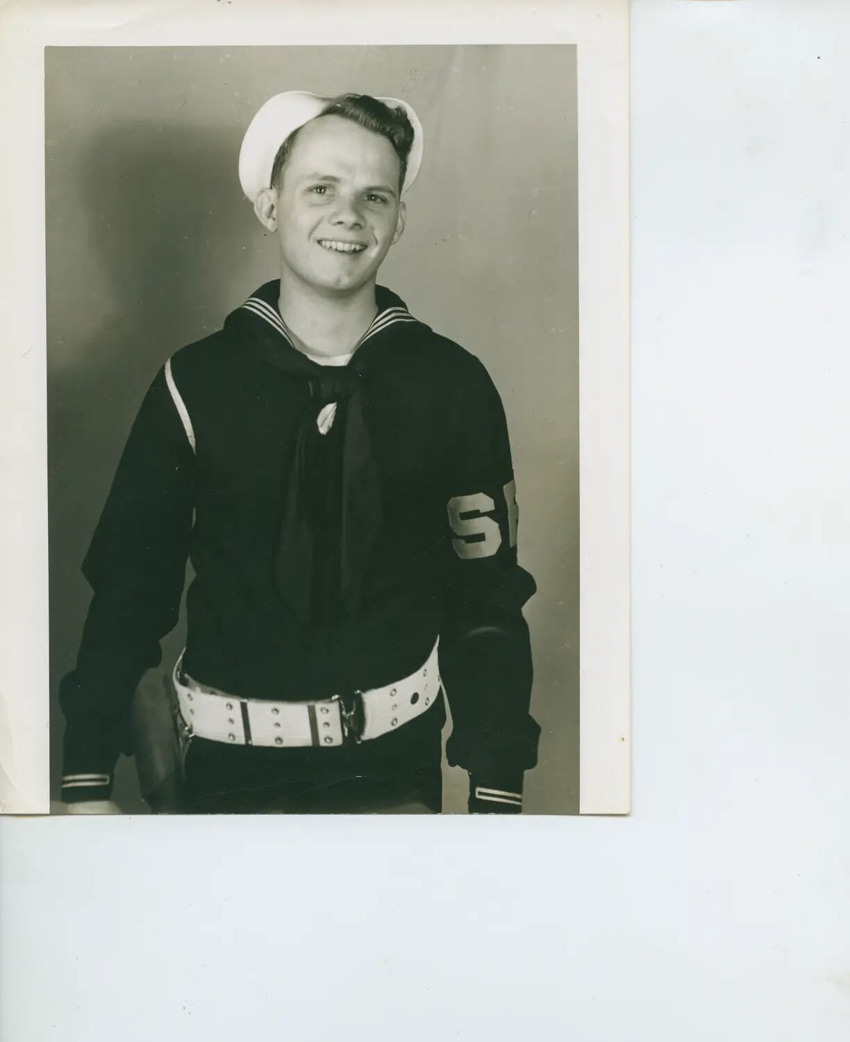 Studio Portrait of U.S. Navy Sailor in Dress Blues with Shore Patrol Duty Belt (USS Petrof Bay Collection)