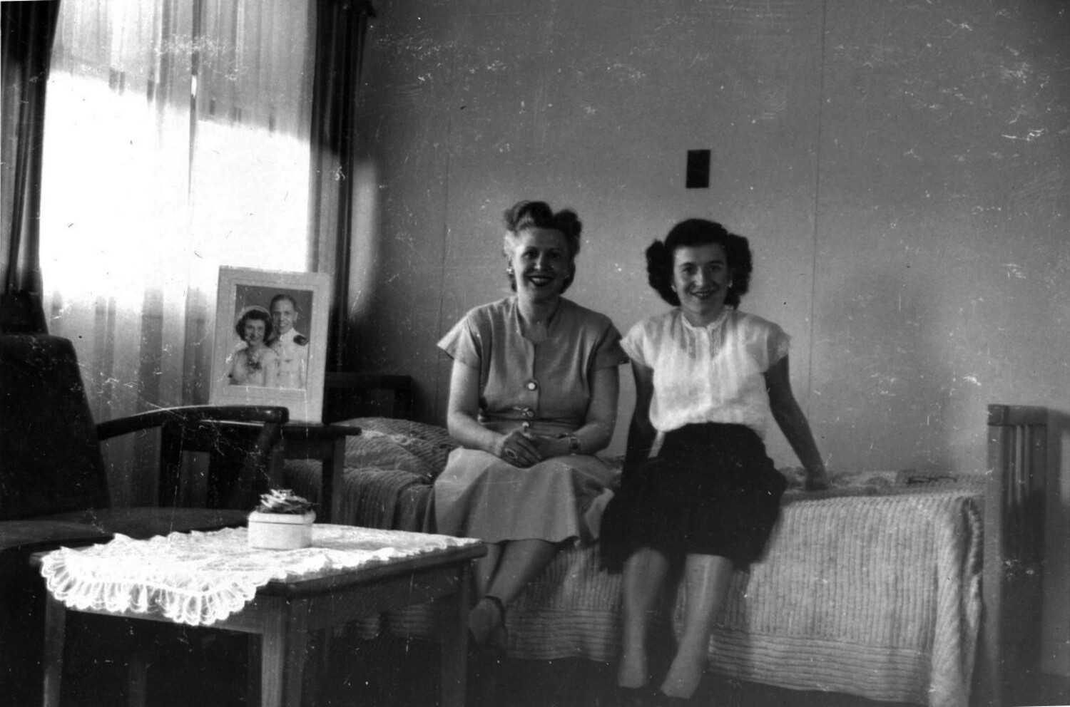 Two Women Seated in Living Room, with Framed Naval Officer Portrait (Bancroft Korean War Collection)