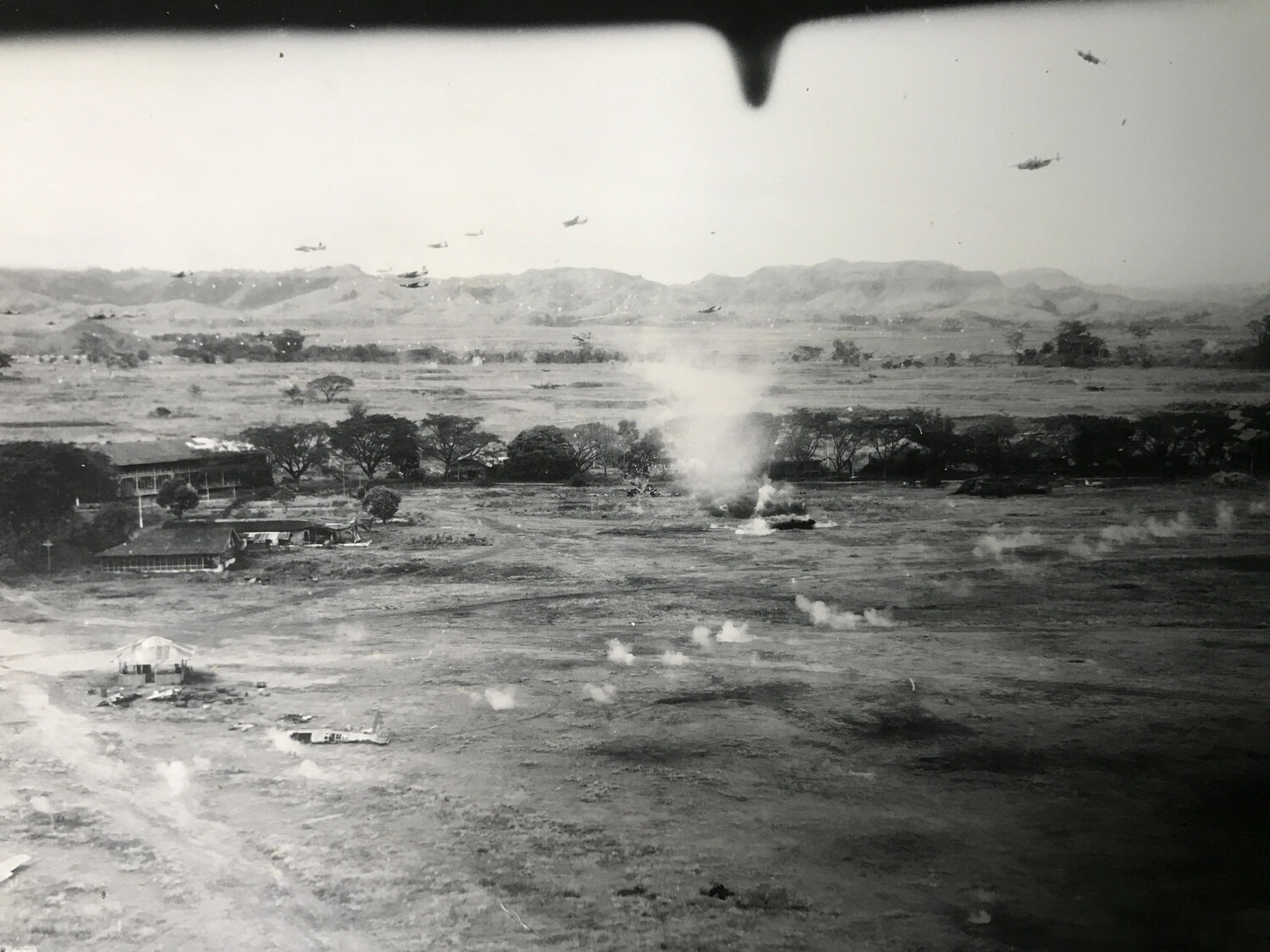 Formation of Attack Aircraft and Ground Explosions Over Target, Markham-Ramu Valley, New Guinea