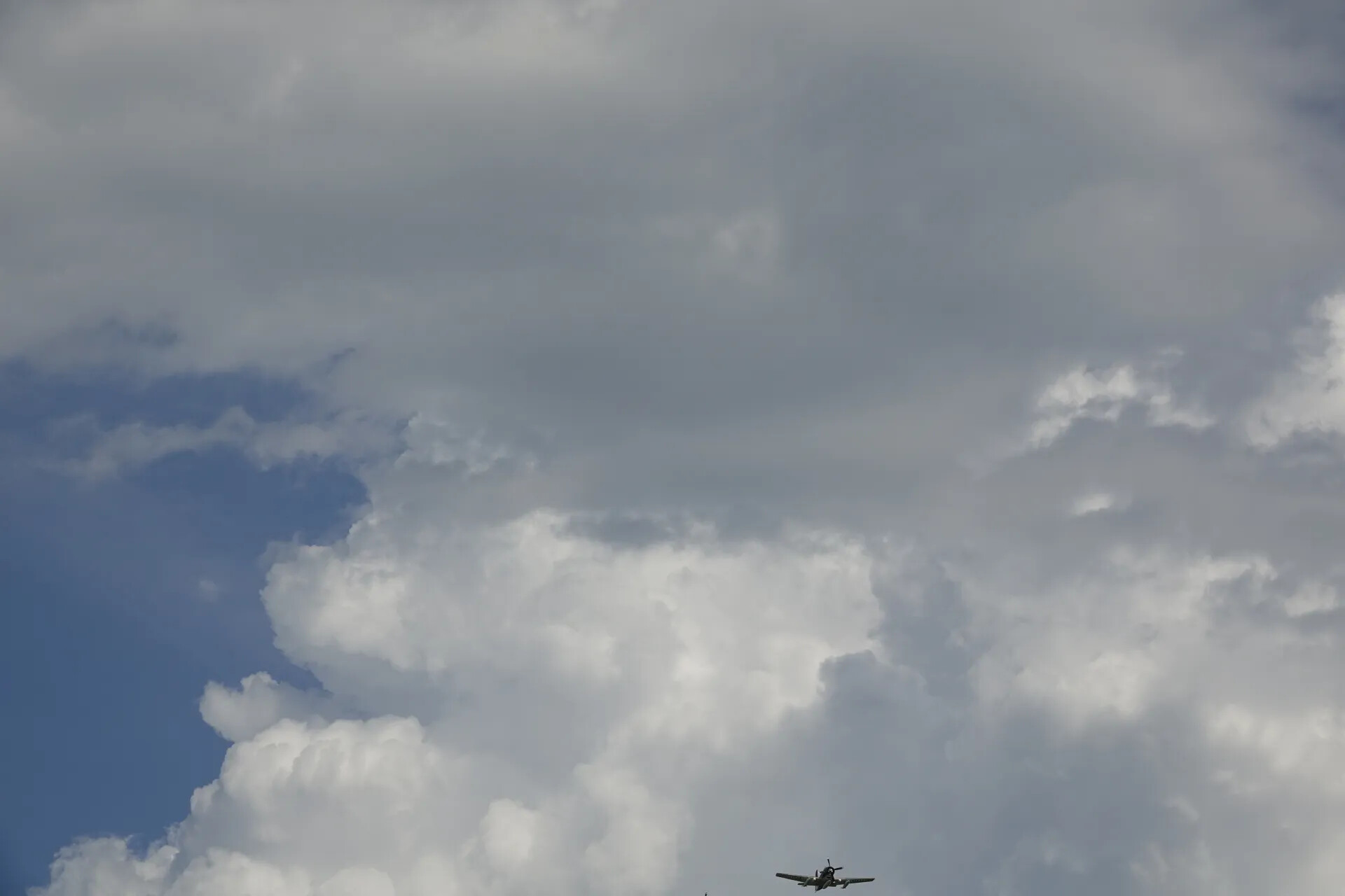 Warbird Aircraft in Flight Against Cumulus Cloudscape, May 2019 Air Show Event