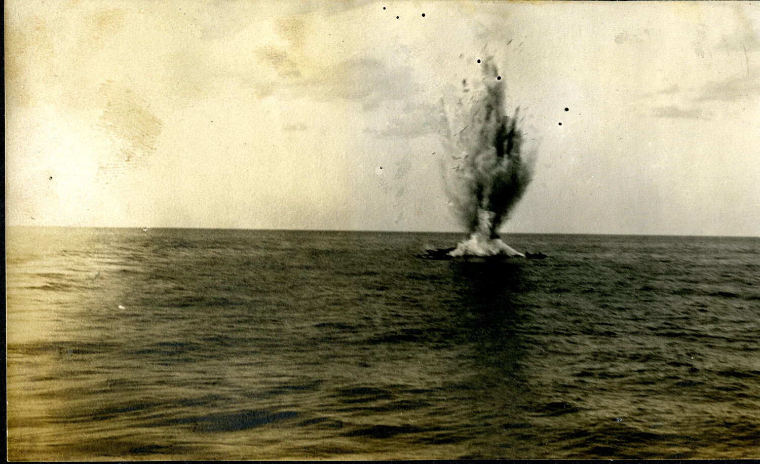 Demolition Charge Destroying a Derelict Wreck at Sea, USS Columbia Album, c. 1900-1910