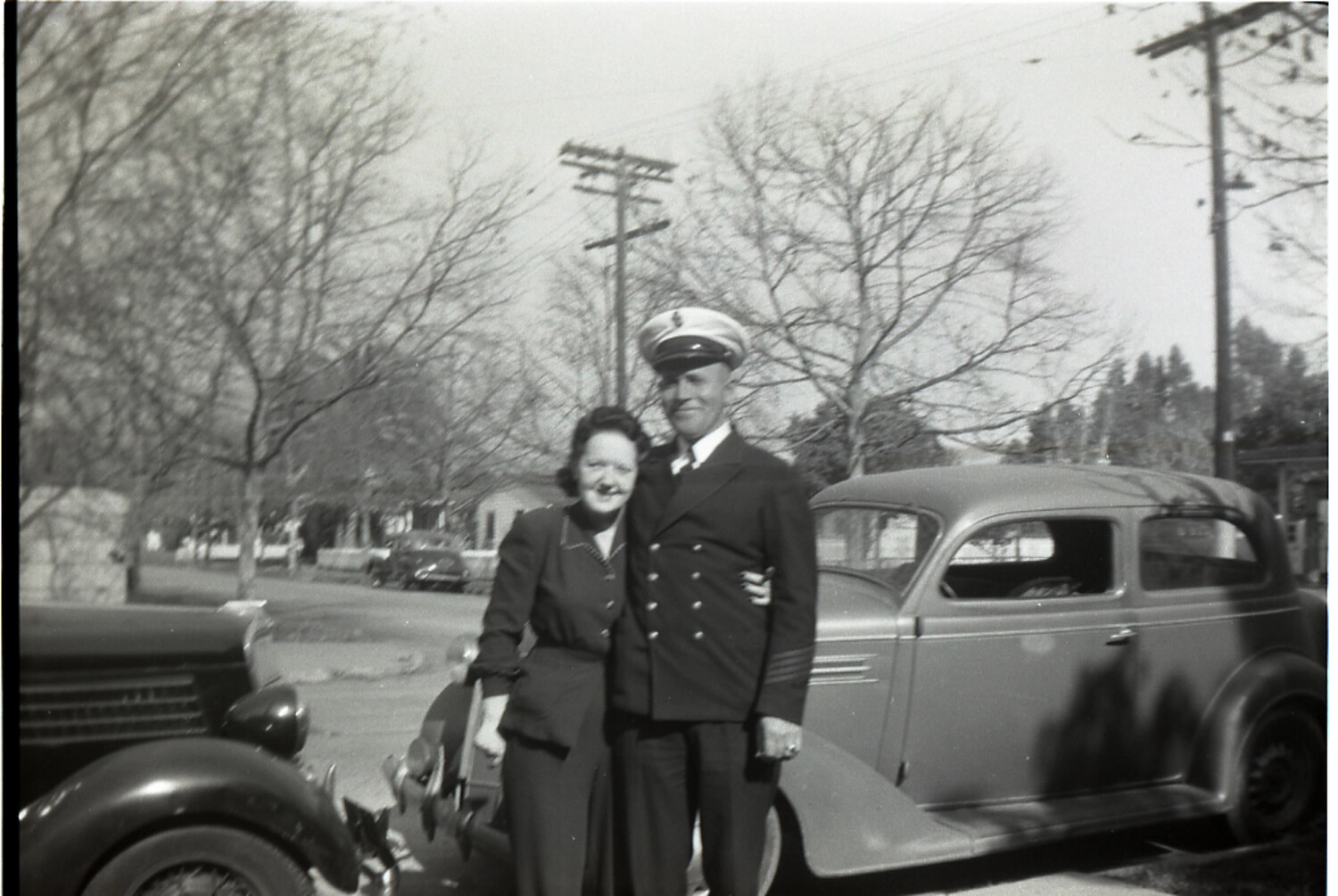 Uniformed Officer and Companion on a Residential Street