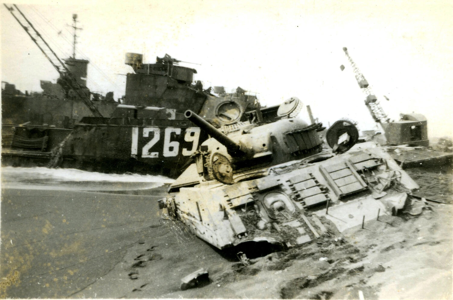 Destroyed M4 Sherman Tank and Beached LST-1269, Iwo Jima, 1945