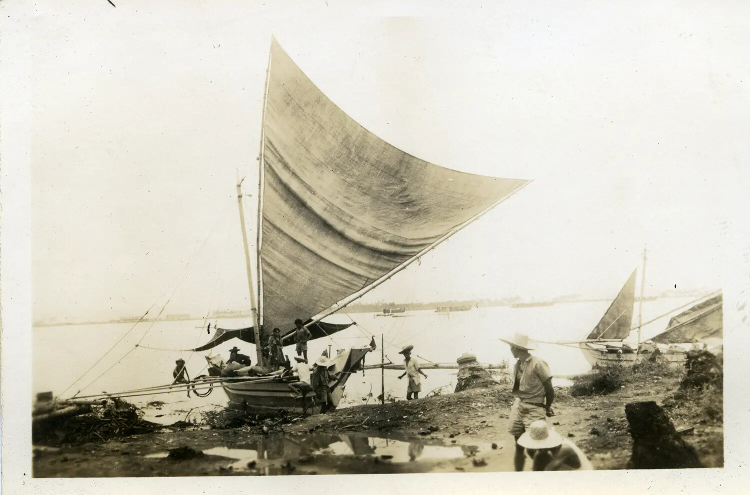 Traditional Sailing Vessel with American Servicemen Ashore, Philippines, 312th Bombardment Group Collection, WWII