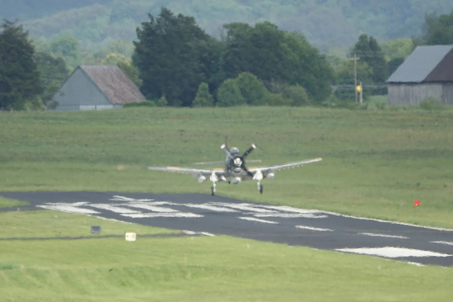 Douglas A-1 Skyraider Departing Grass-Bordered Runway, Rural Airfield Fly-In