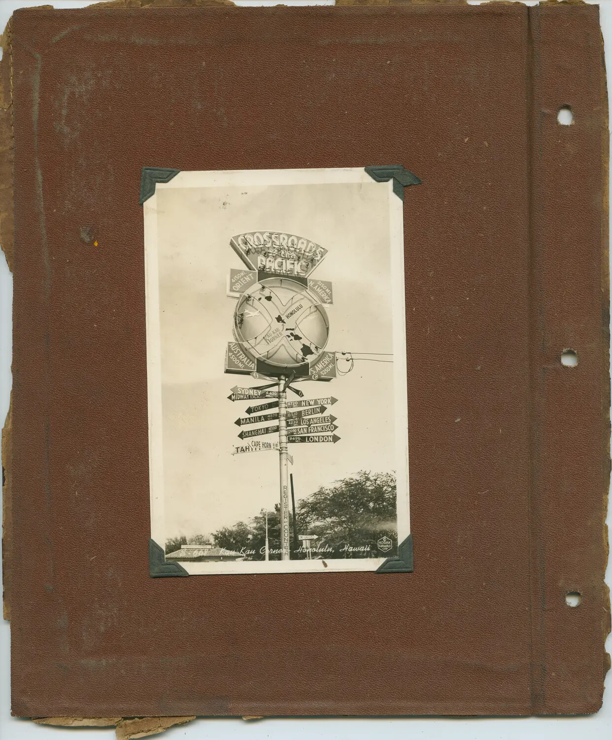 Photo Album Page: 'Crossroads of the Pacific' Signpost, Kau Kau Corner, Honolulu, Hawaii, WWII Era