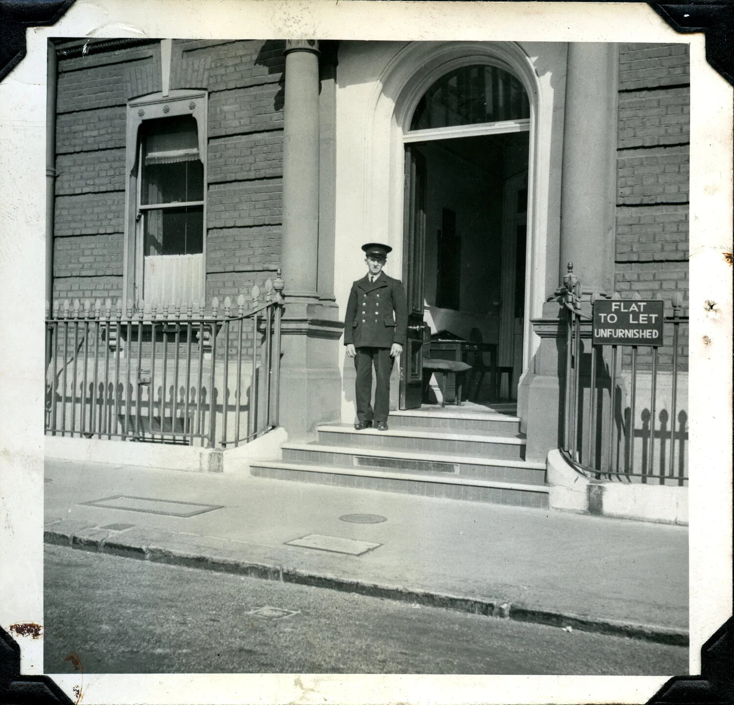 Uniformed Man Before London Townhouse with "Flat to Let" Sign, Jervey Signal Corps Album