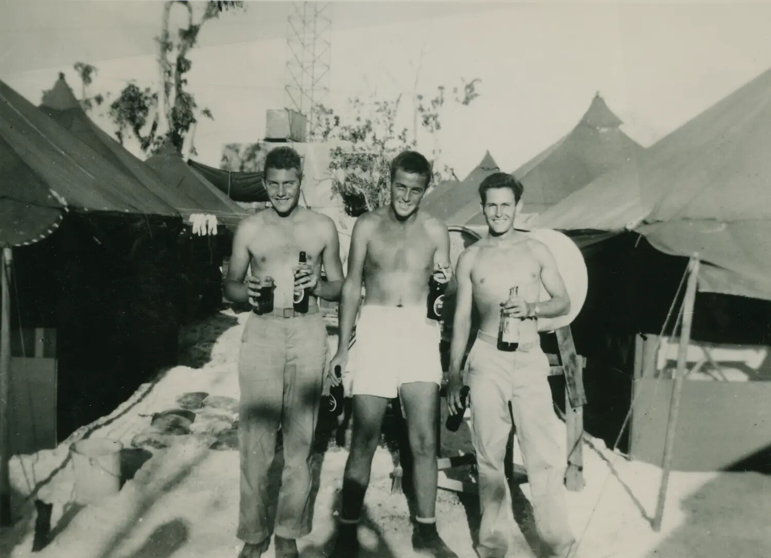 Three Servicemen Relaxing with Beverages at Tropical Tent Camp, WWII Pacific Theater (McAleer Collection)