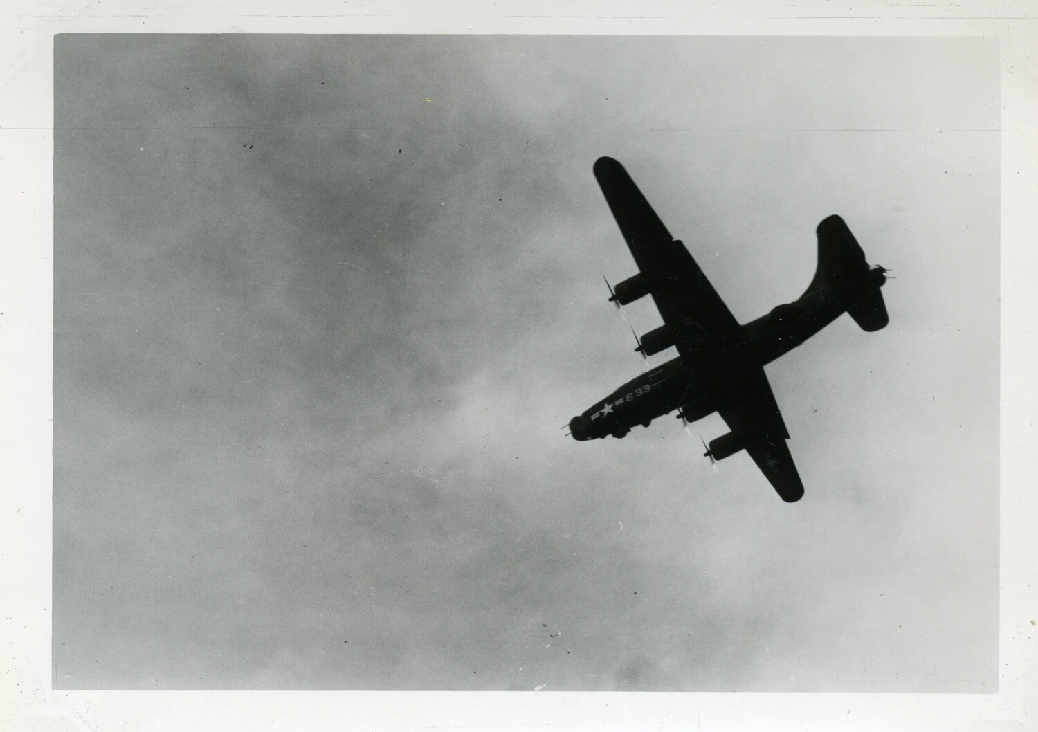 Four-Engine Liberator-Type Aircraft in Flight, Banking Below Overcast Sky, Guam Area