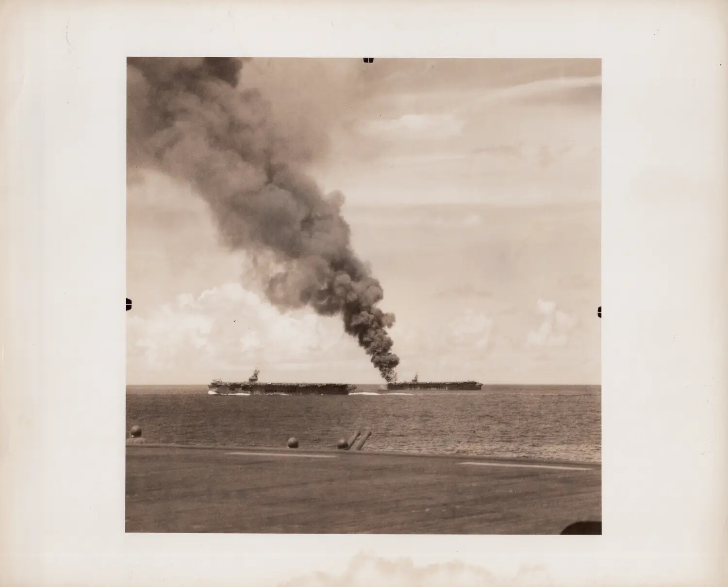 Escort Carrier Burning After Kamikaze Strike, Viewed Alongside a Second Escort Carrier from USS Petrof Bay's Flight Deck, 26 October 1944