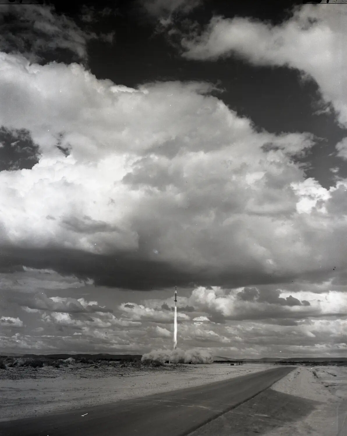 Nike Missile Launch — Ascent Against Desert Storm Clouds