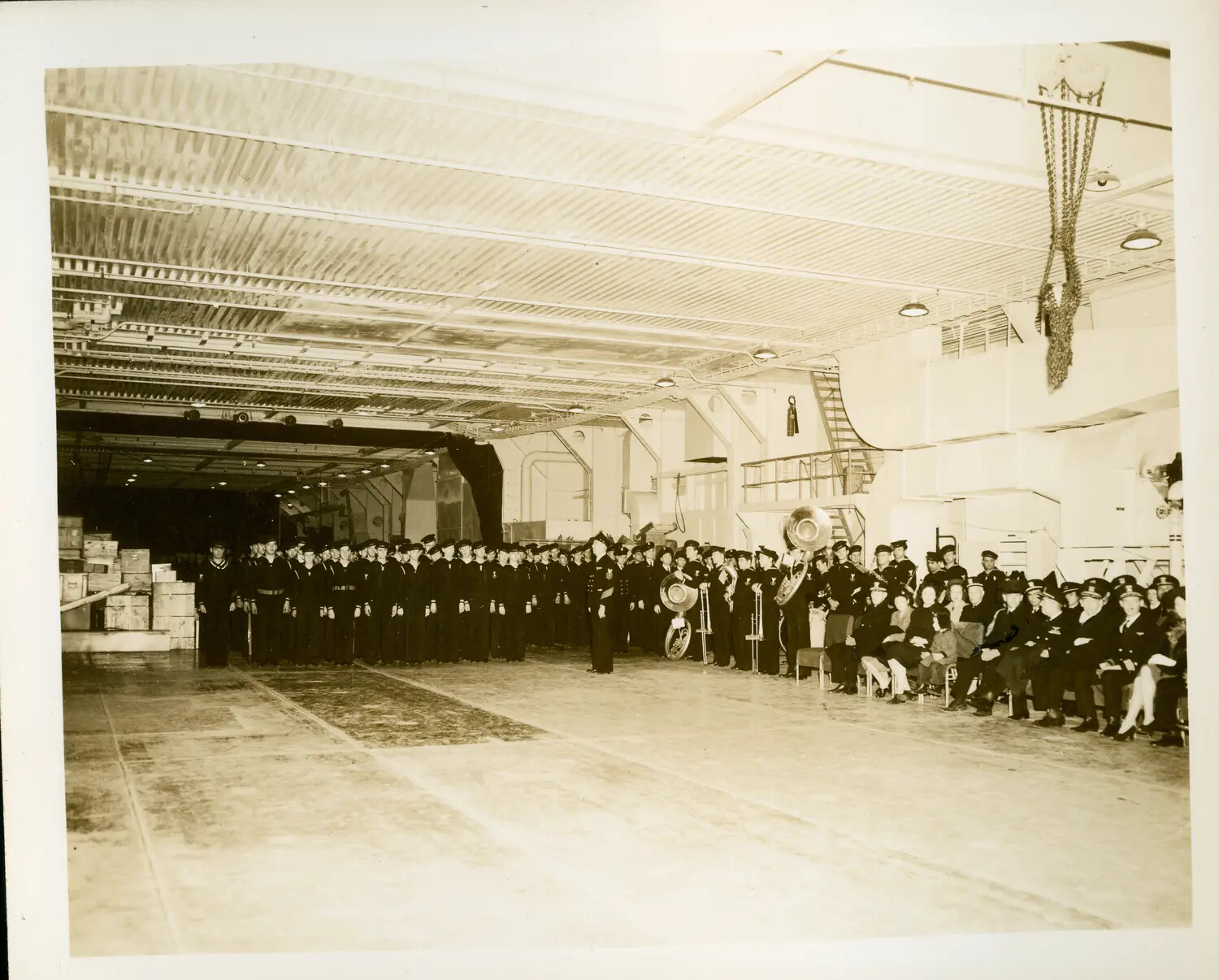 Ceremonial Muster on the Hangar Deck of USS Petrof Bay (CVE-80)