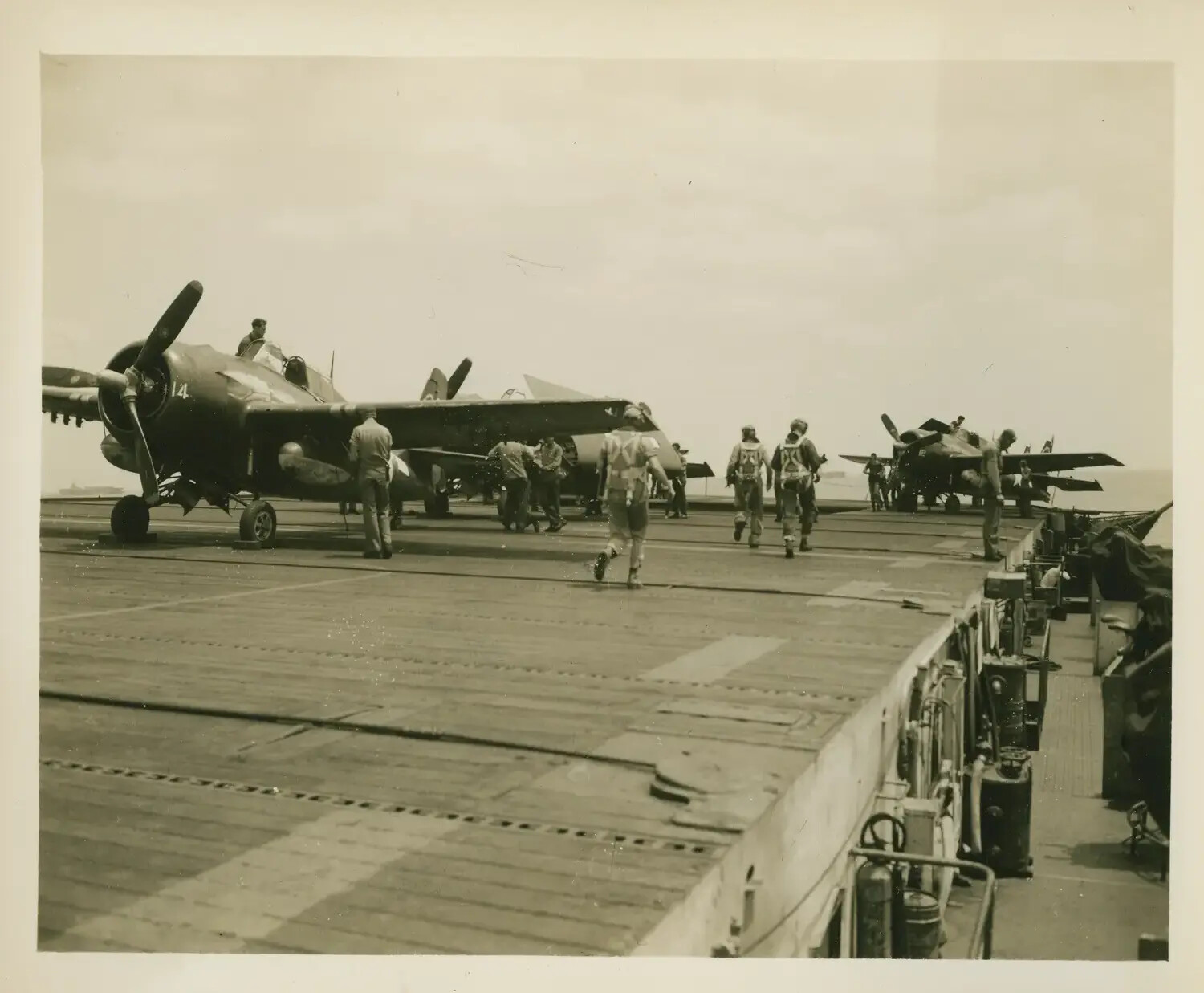 Flight Deck Operations Aboard USS Petrof Bay (CVE-80): FM-2 Wildcats and Aircrew Preparing to Launch