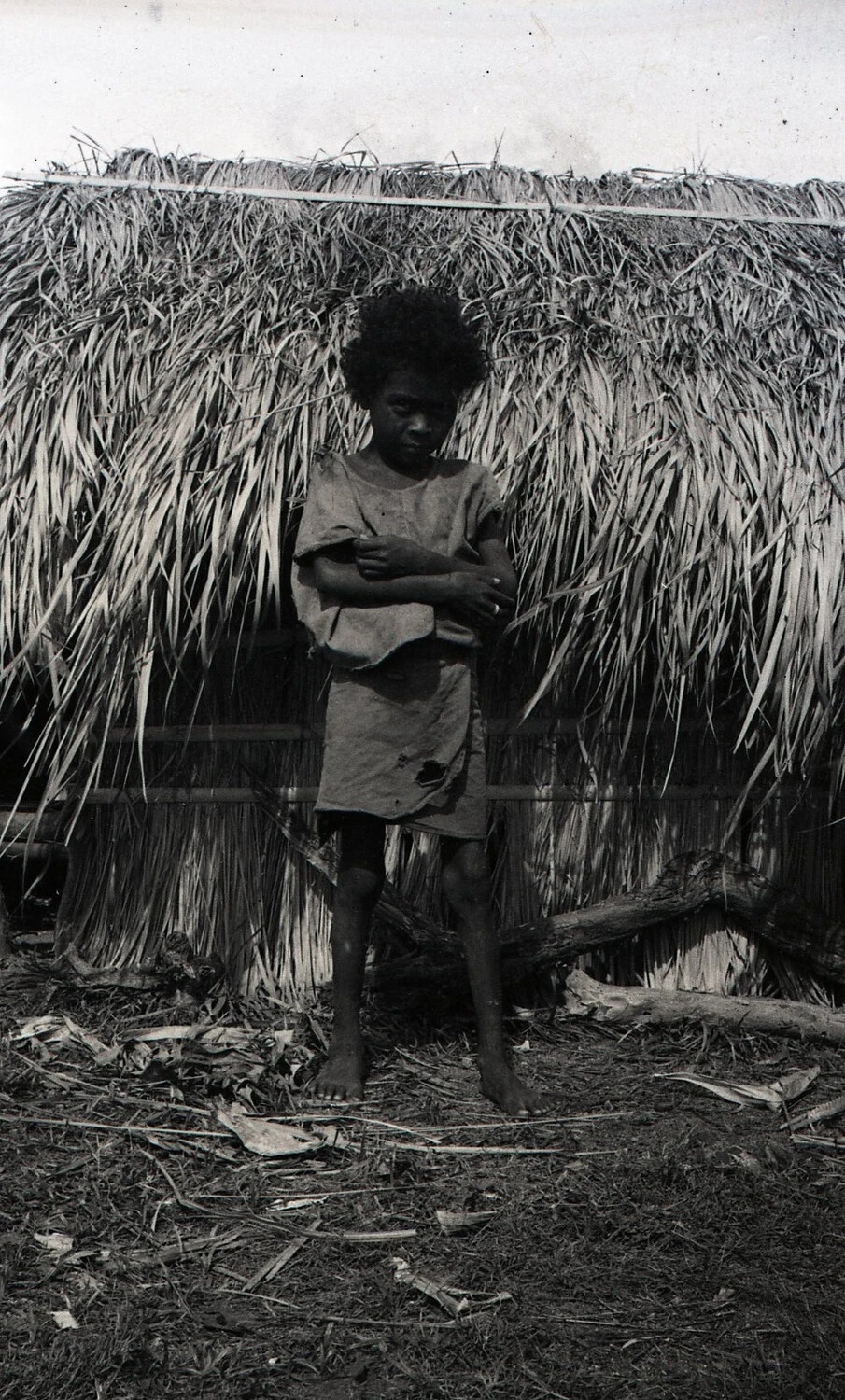 Filipino Child in Front of Nipa Hut, Luzon, Philippines, WWII Era