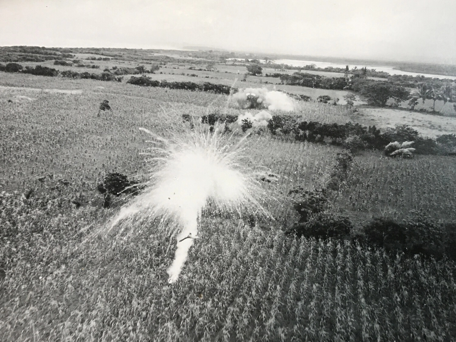 Fragmentation Bomb Detonating Over Agricultural Field